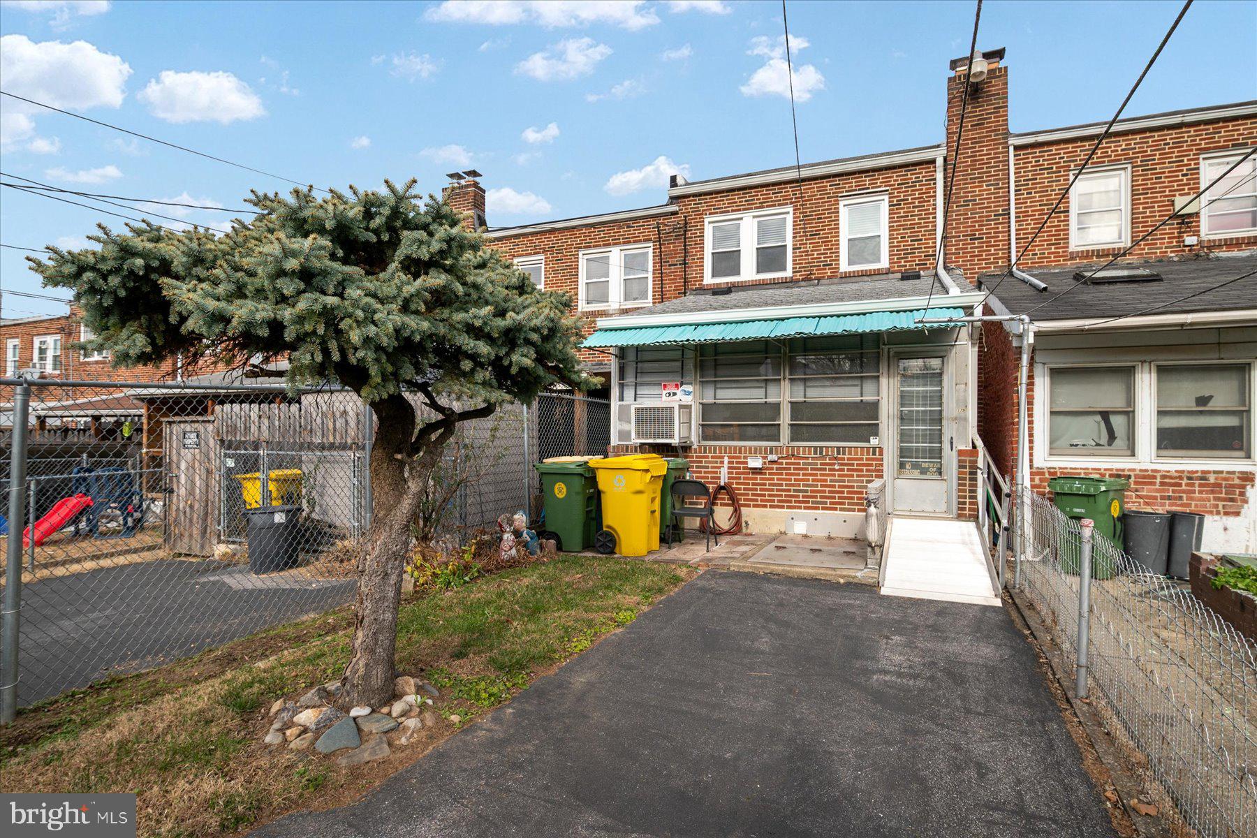 179 West Meadow Road Baltimore, MD 21225 - Photo 34 of 34 a front view of a house with glass door