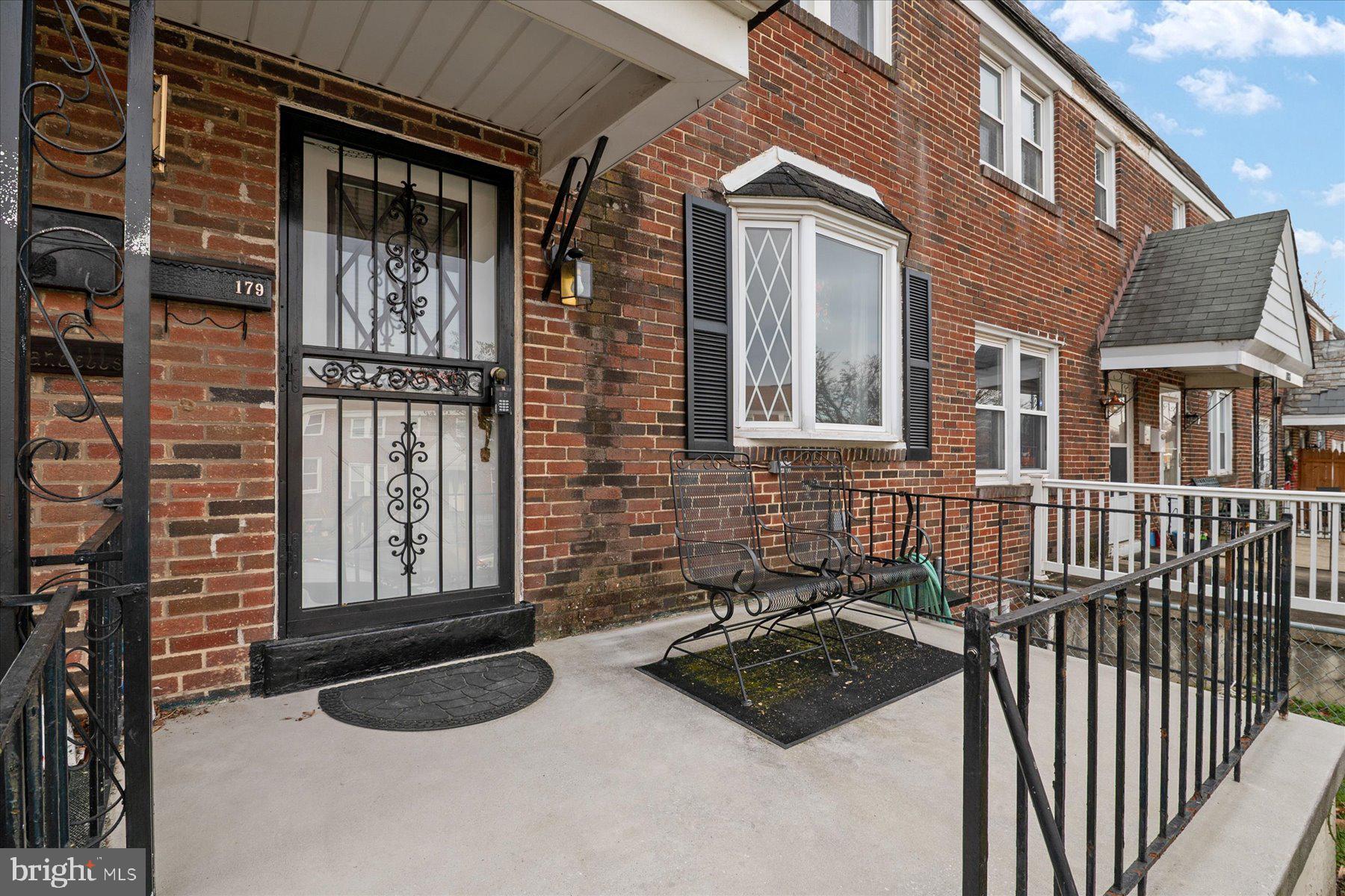 179 West Meadow Road Baltimore, MD 21225 - Photo 6 of 34 a view of a brick house with many windows