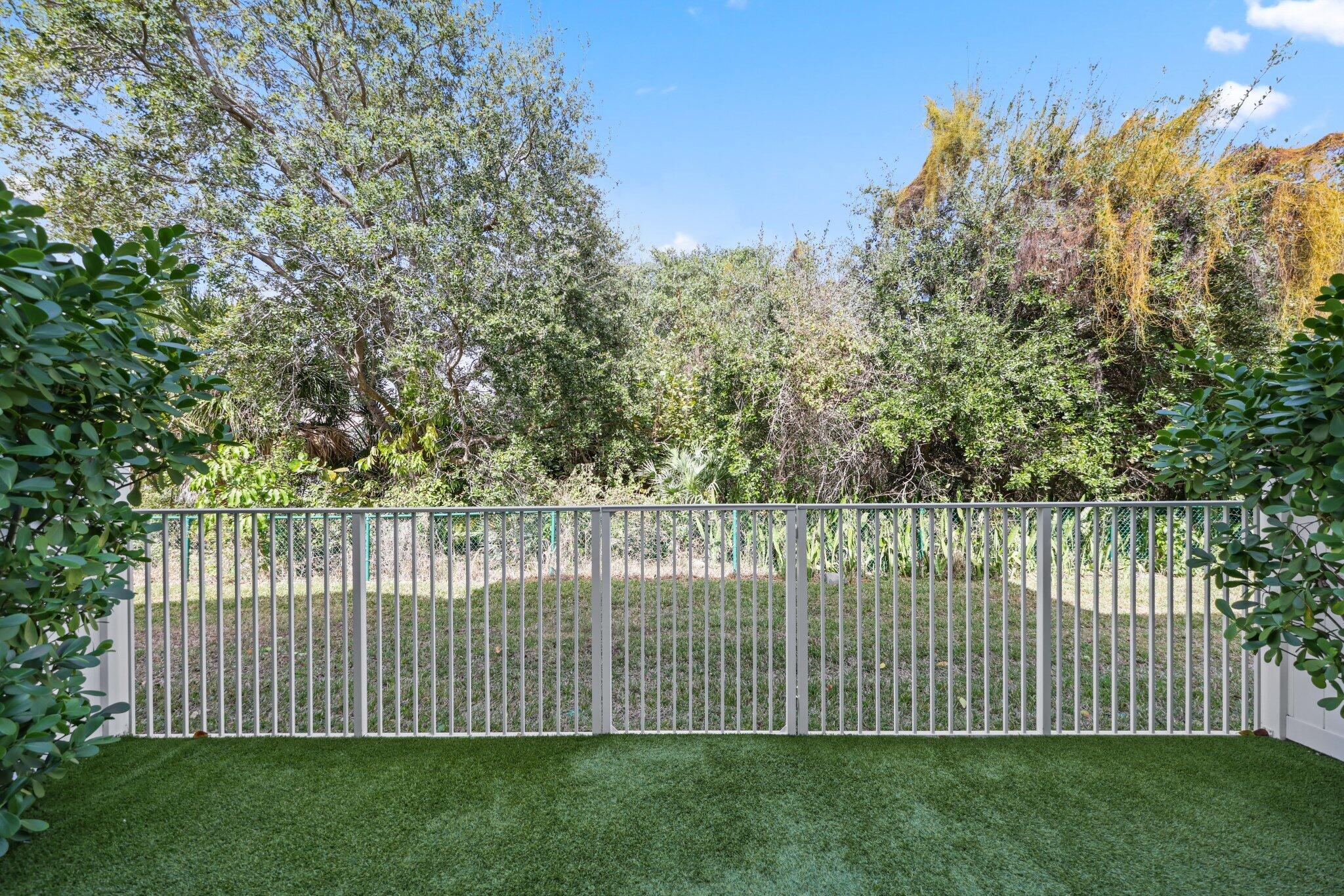 100 Northwest 69th Circle, Unit 24 Boca Raton, FL 33487 - Photo 42 of 61 turfed backyard
