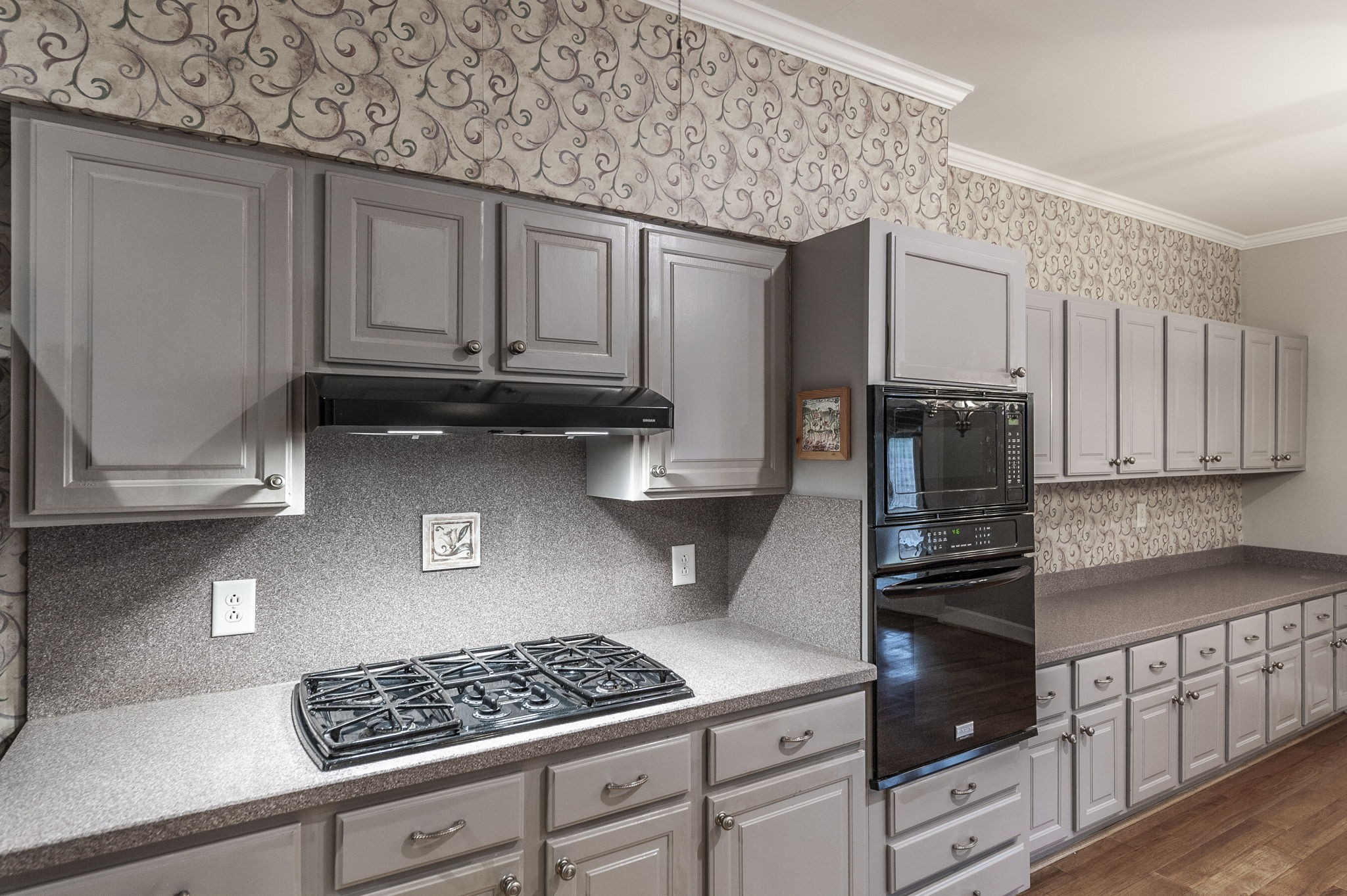 3 Wyndermere Road Hendersonville, TN 37075 - Photo 17 of 42 a kitchen with stainless steel appliances granite countertop a stove a sink and a microwave