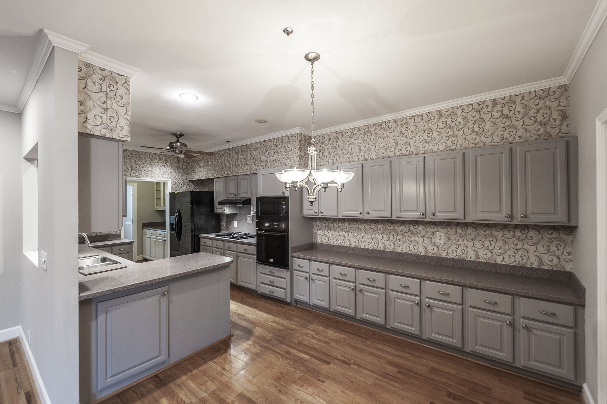 3 Wyndermere Road Hendersonville, TN 37075 - Photo 19 of 42 a kitchen with kitchen island granite countertop a sink cabinets and refrigerator