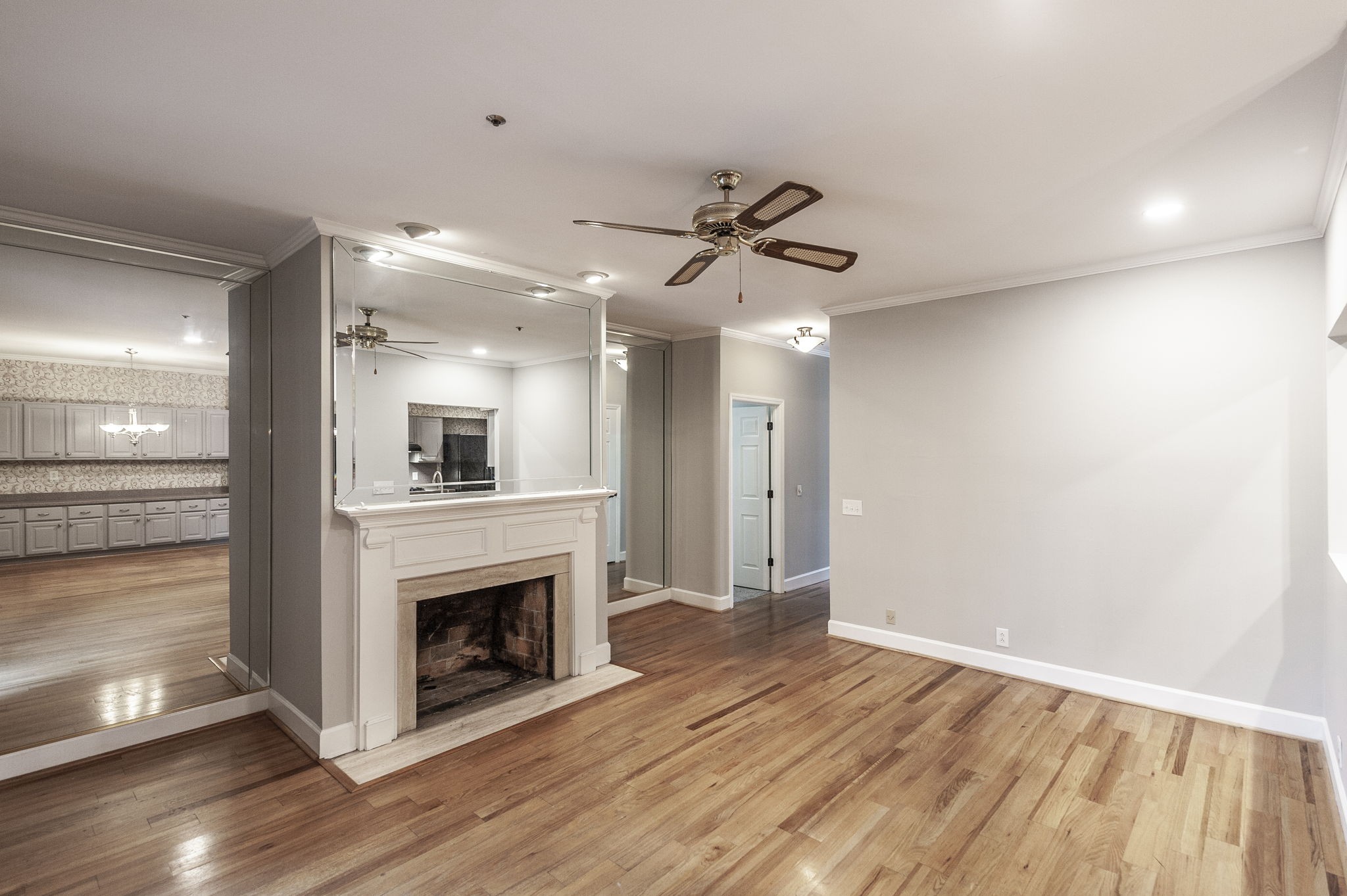 3 Wyndermere Road Hendersonville, TN 37075 - Photo 21 of 42 a view of a livingroom with a fireplace a ceiling fan and wooden floor