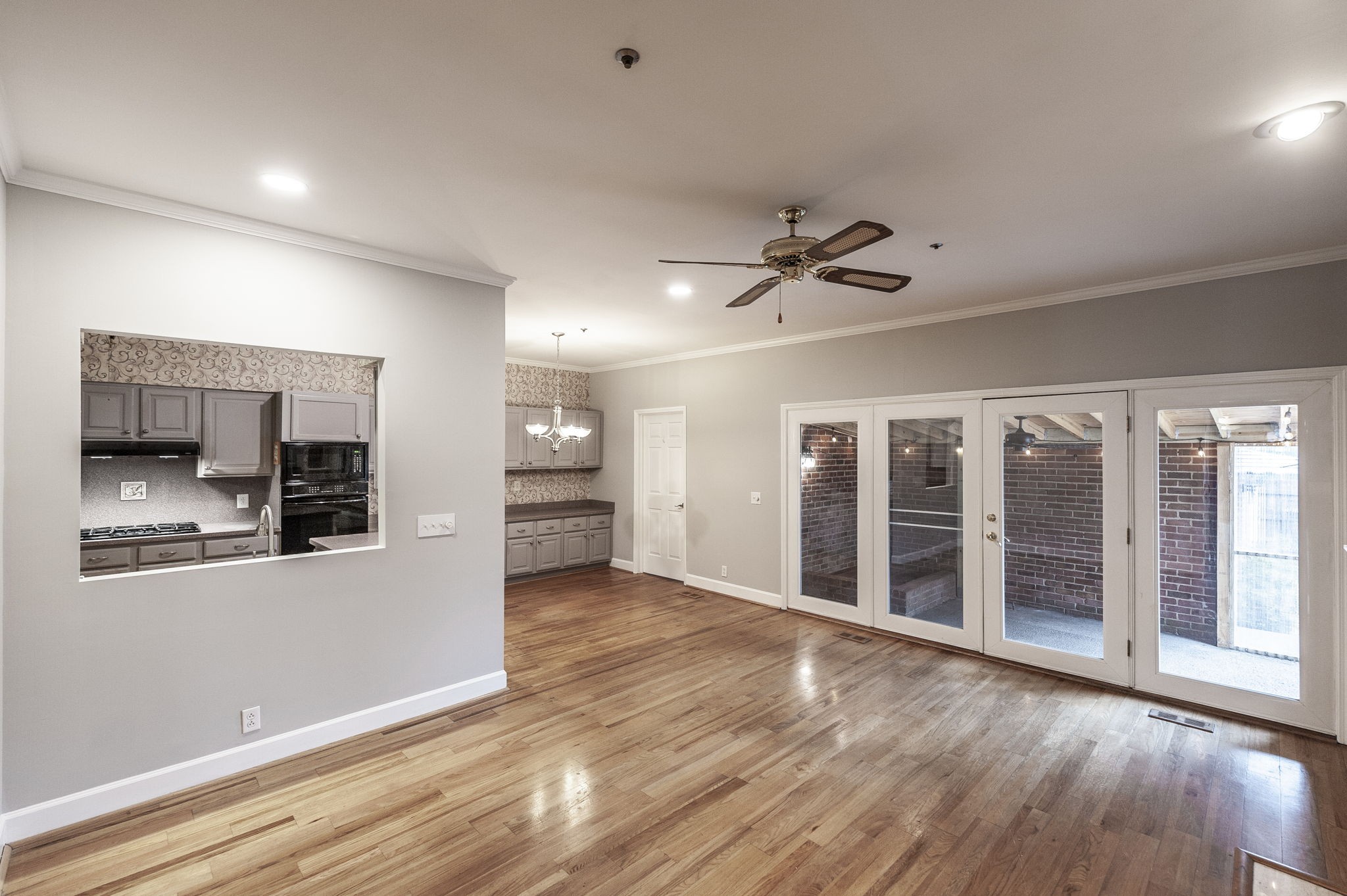 3 Wyndermere Road Hendersonville, TN 37075 - Photo 24 of 42 an empty room with wooden floor and a kitchen