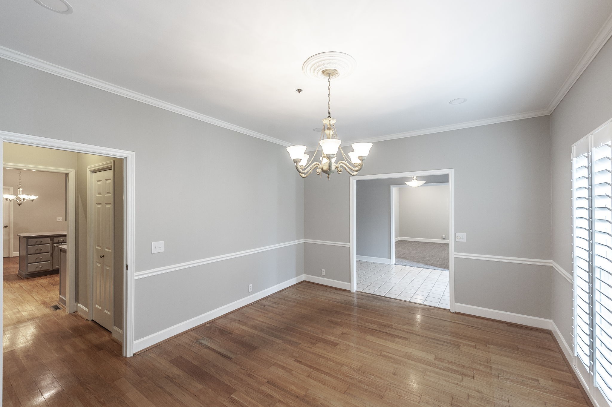 3 Wyndermere Road Hendersonville, TN 37075 - Photo 8 of 42 an empty room with wooden floor chandelier and windows