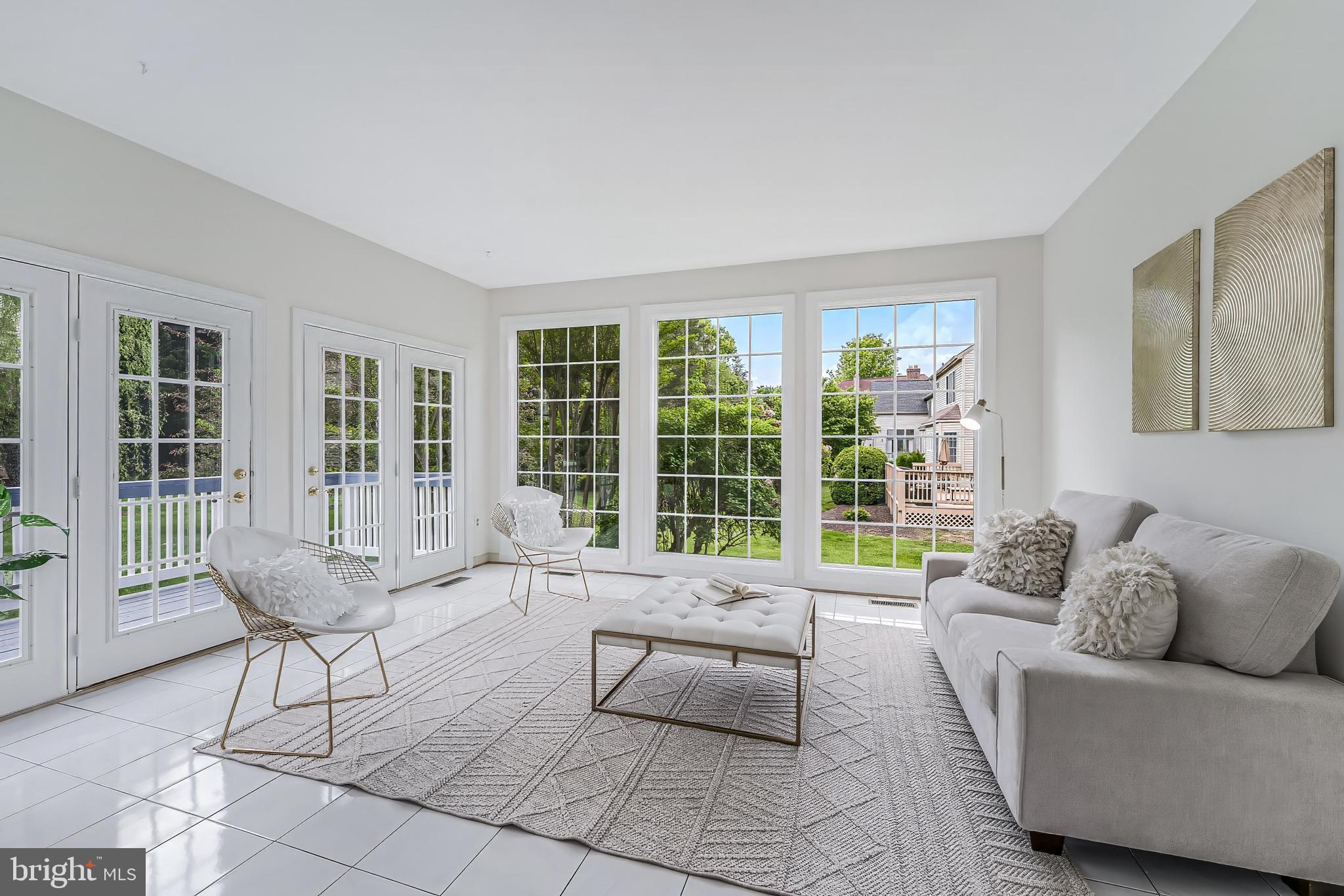 5501 Ashleigh Road Fairfax, VA 22030 - Photo 21 of 77 a living room with furniture and floor to ceiling windows