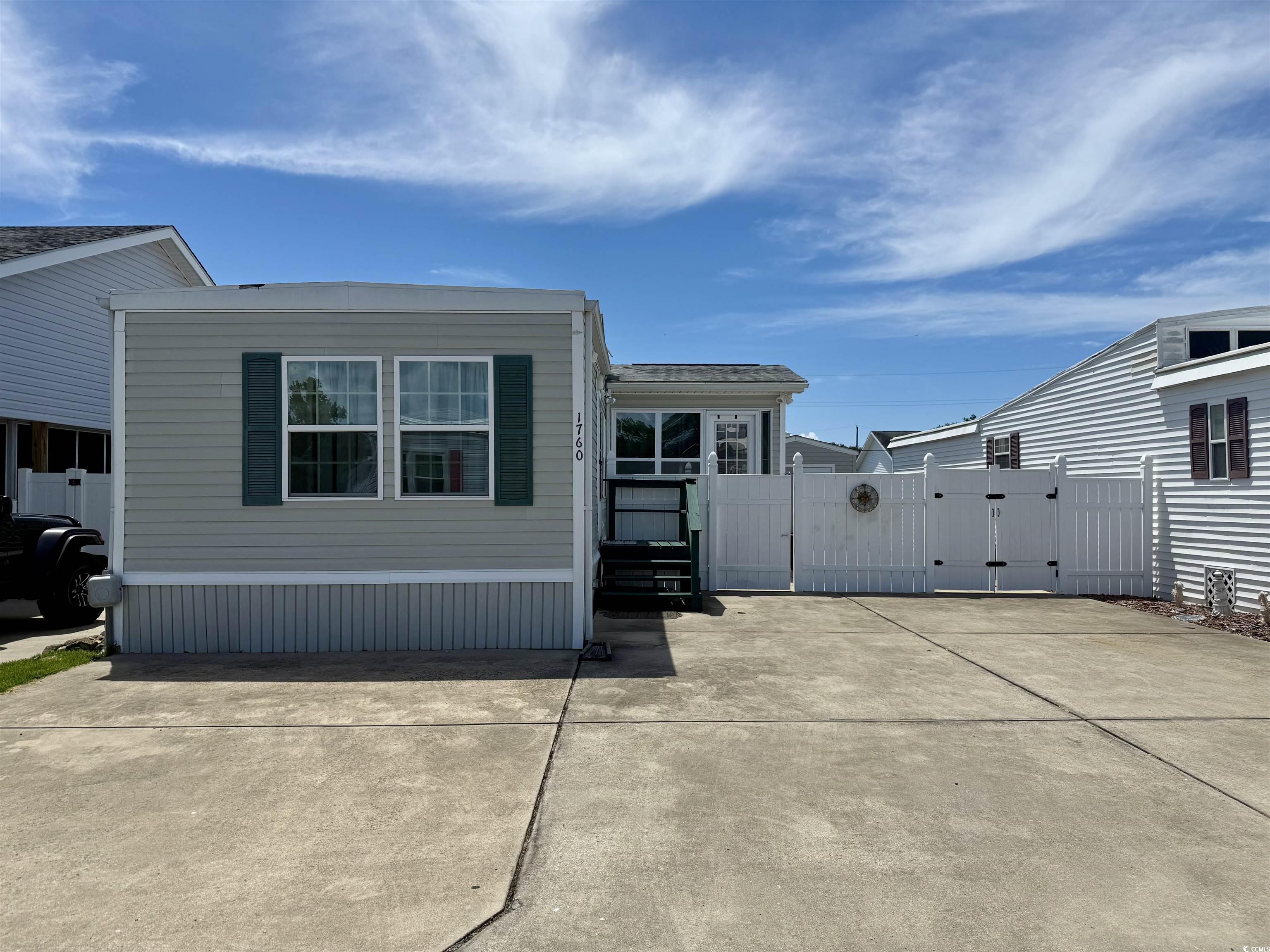 1760 Egret Surfside Beach, SC 29575 - Photo 1 of 29 Rear view of property featuring a gate