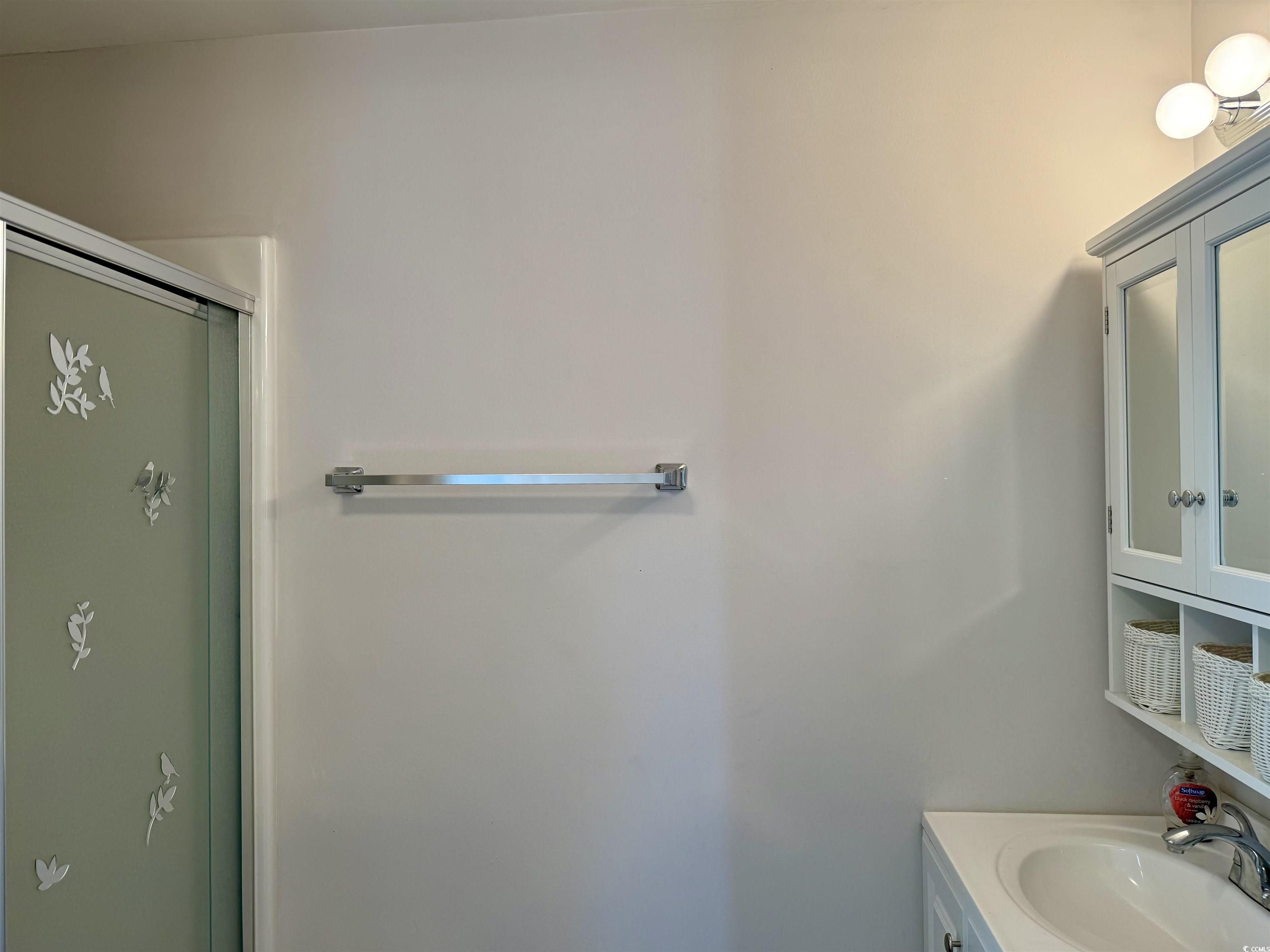 1760 Egret Surfside Beach, SC 29575 - Photo 11 of 29 Bathroom with vanity and a shower with door