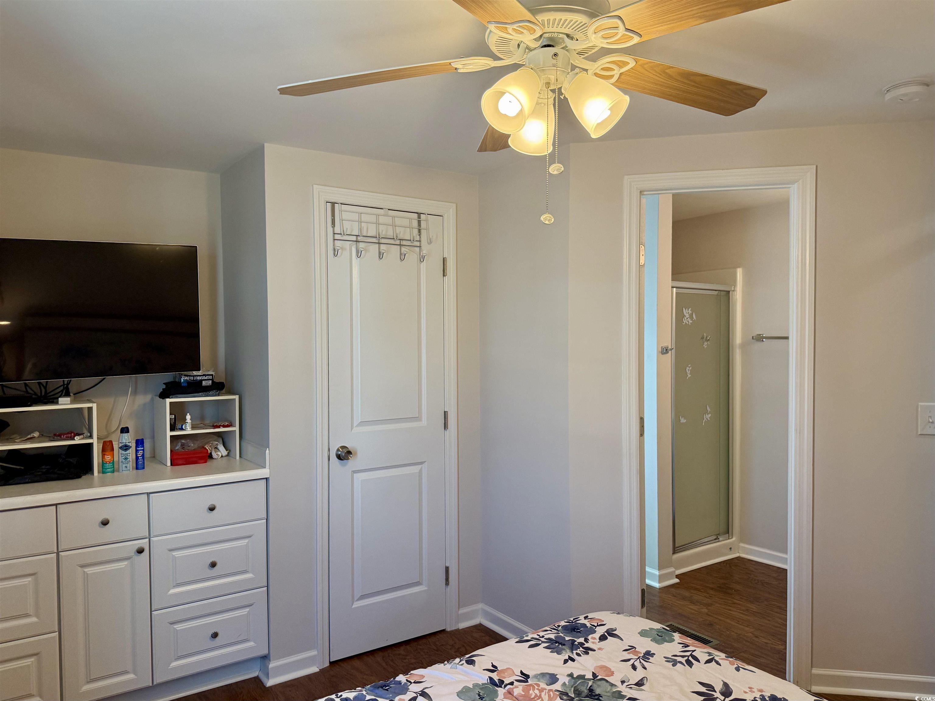 1760 Egret Surfside Beach, SC 29575 - Photo 12 of 29 Bedroom featuring dark wood finished floors and ceiling fan