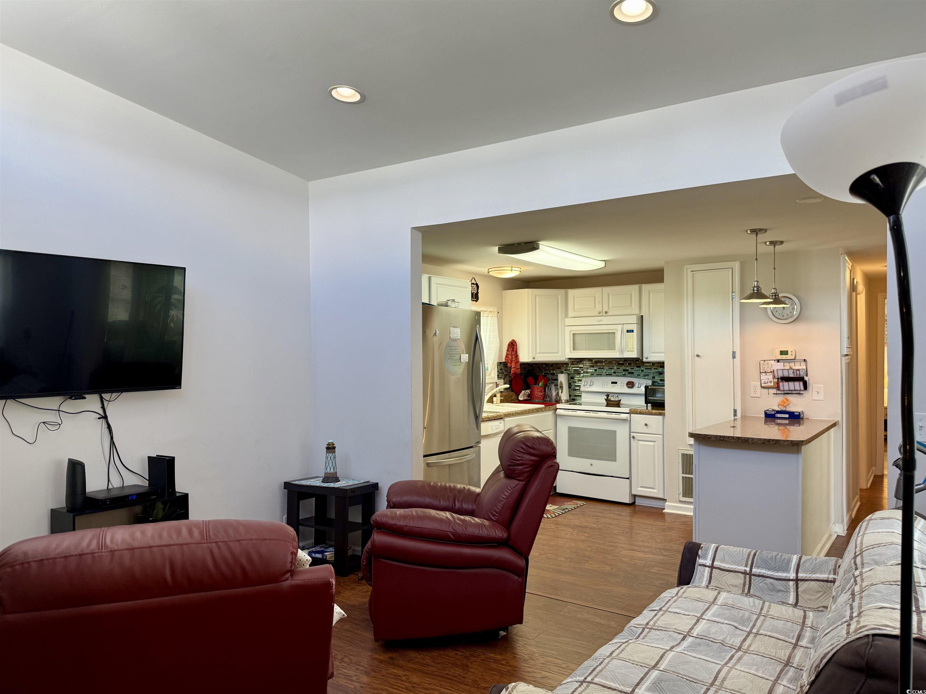 1760 Egret Surfside Beach, SC 29575 - Photo 13 of 29 Living area with dark wood-style floors and recessed lighting
