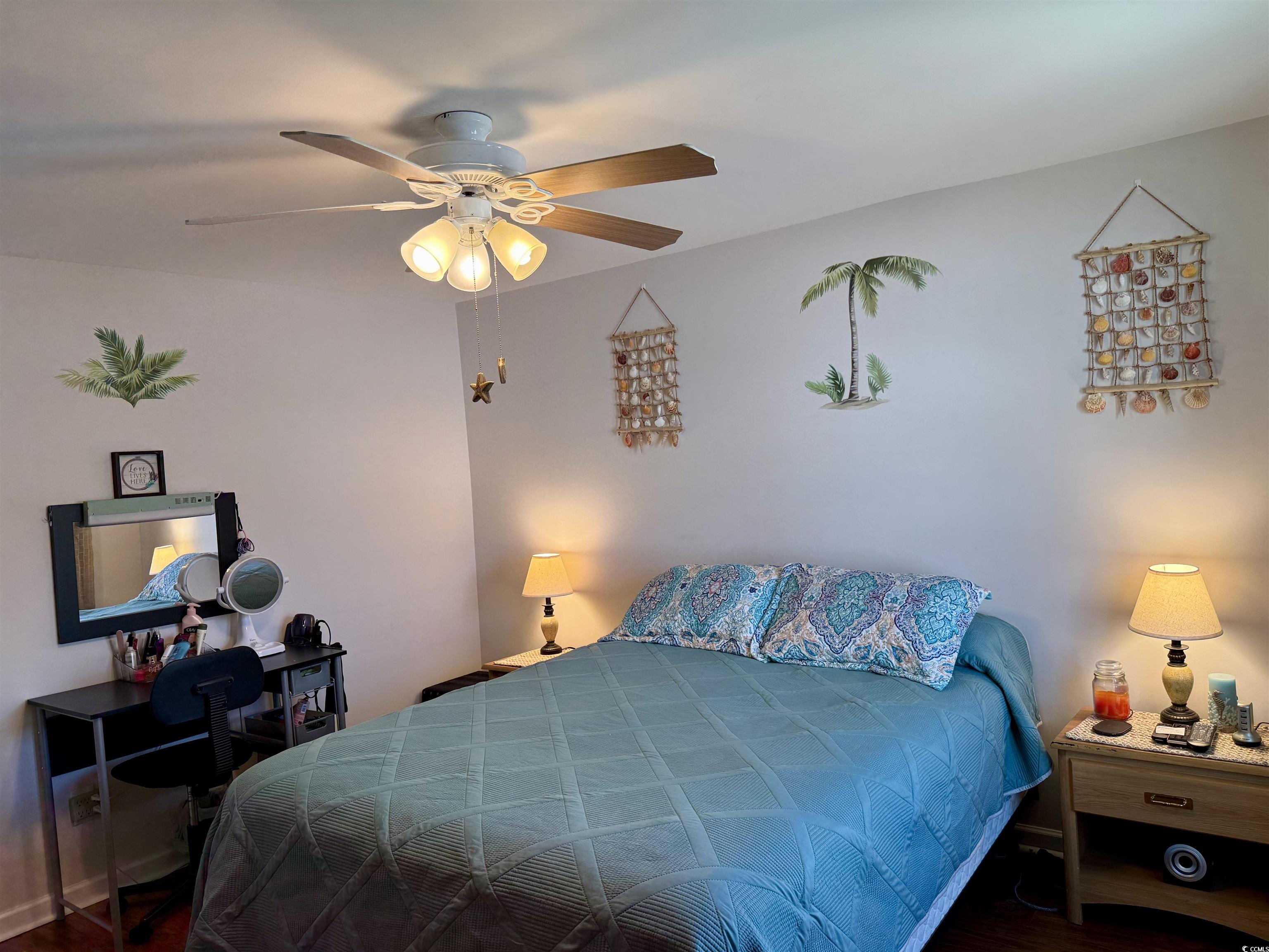 1760 Egret Surfside Beach, SC 29575 - Photo 15 of 29 Bedroom with a ceiling fan and wood finished floors