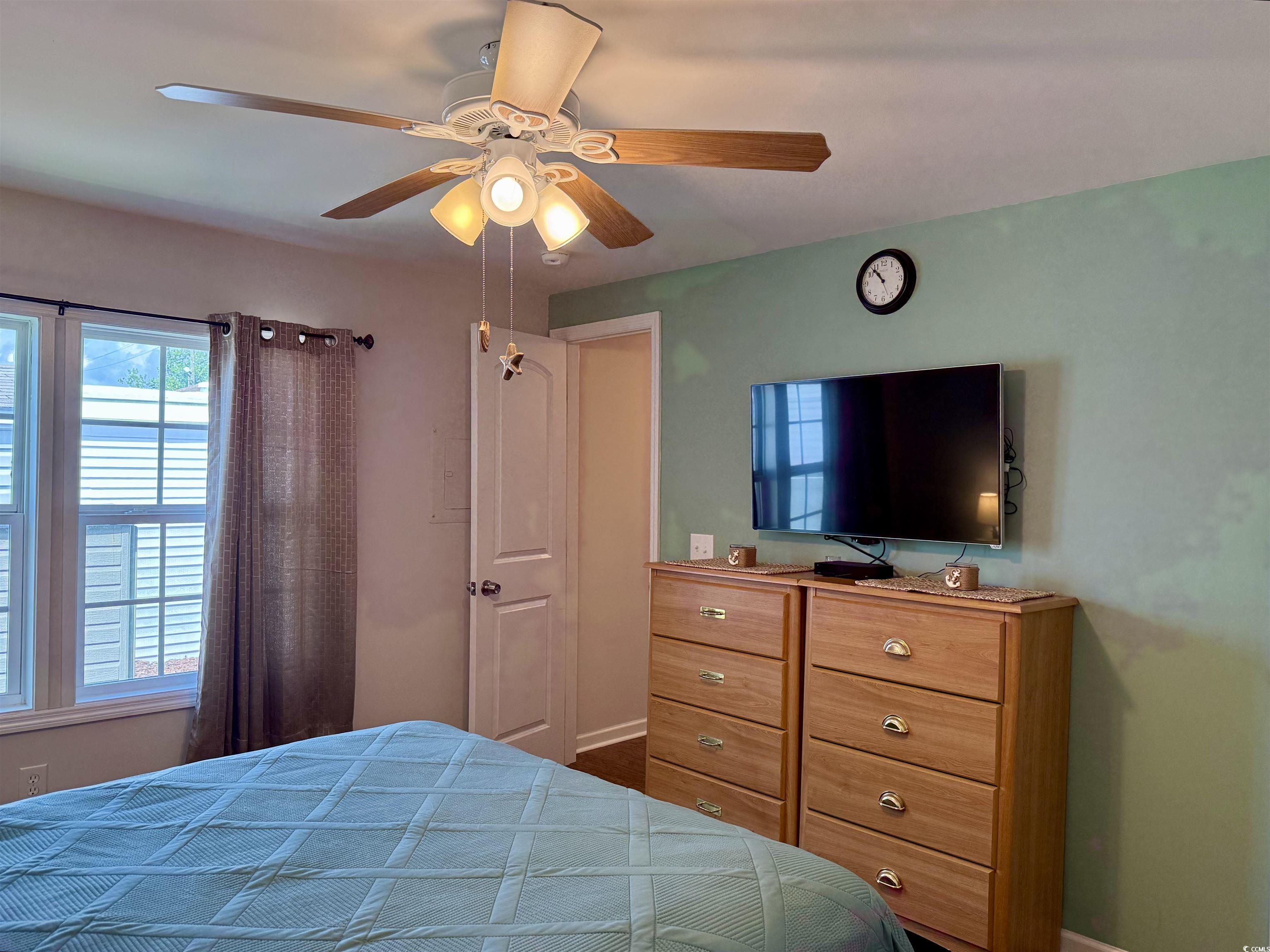 1760 Egret Surfside Beach, SC 29575 - Photo 18 of 29 Bedroom with a ceiling fan and baseboards