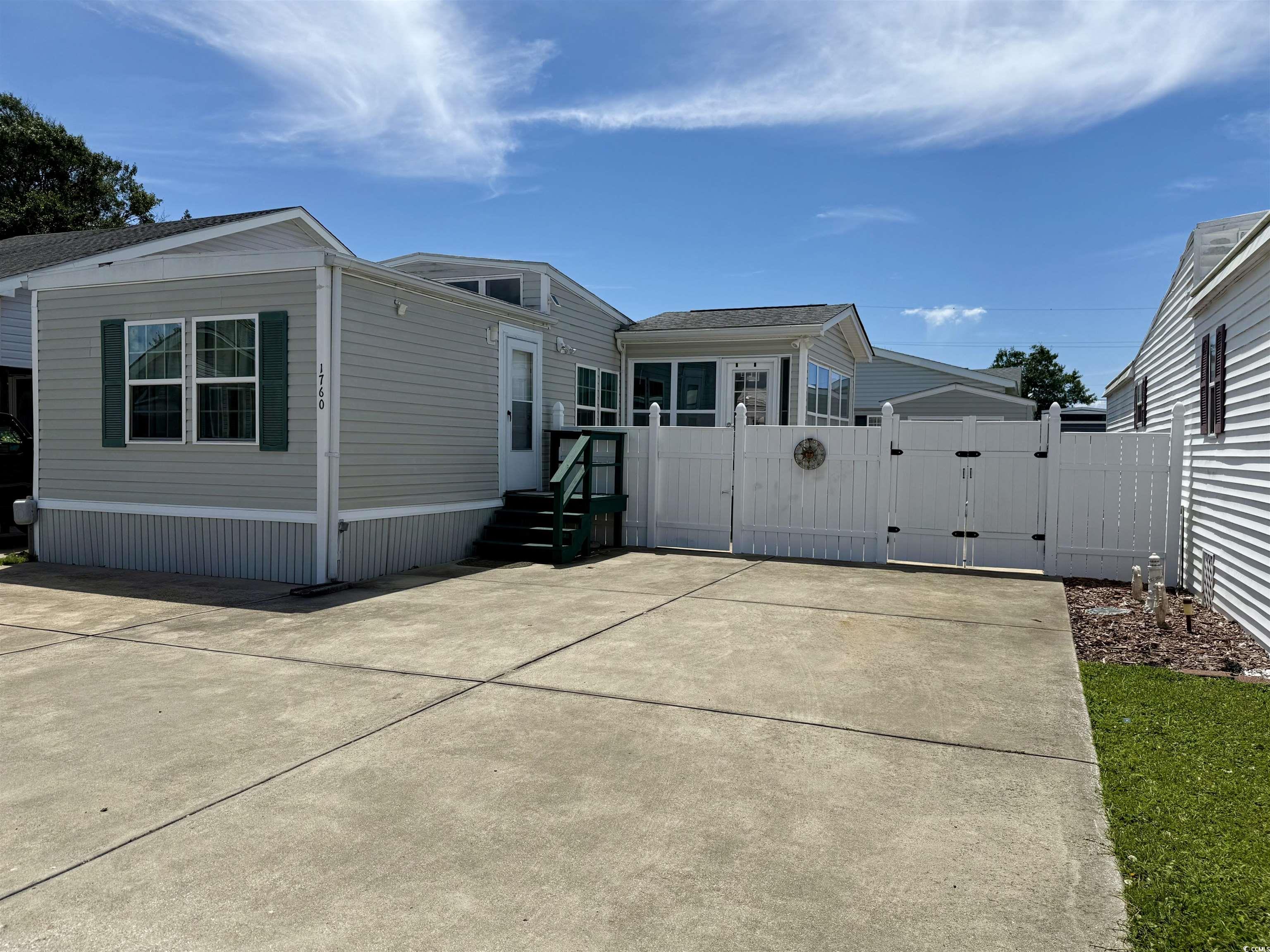 1760 Egret Surfside Beach, SC 29575 - Photo 22 of 29 Rear view of property with a gate