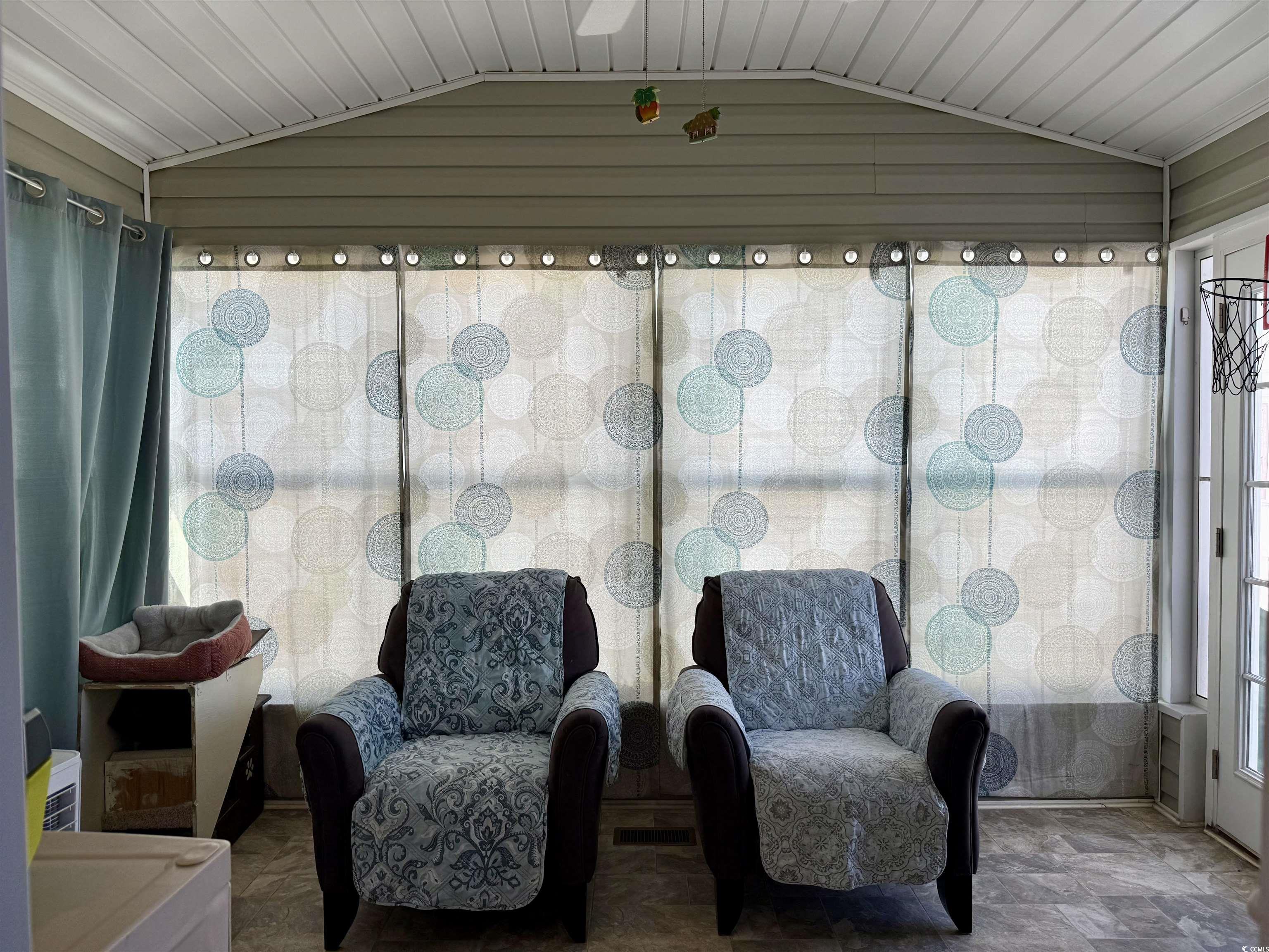 1760 Egret Surfside Beach, SC 29575 - Photo 5 of 29 Sunroom / solarium with vaulted ceiling and stone finish floors