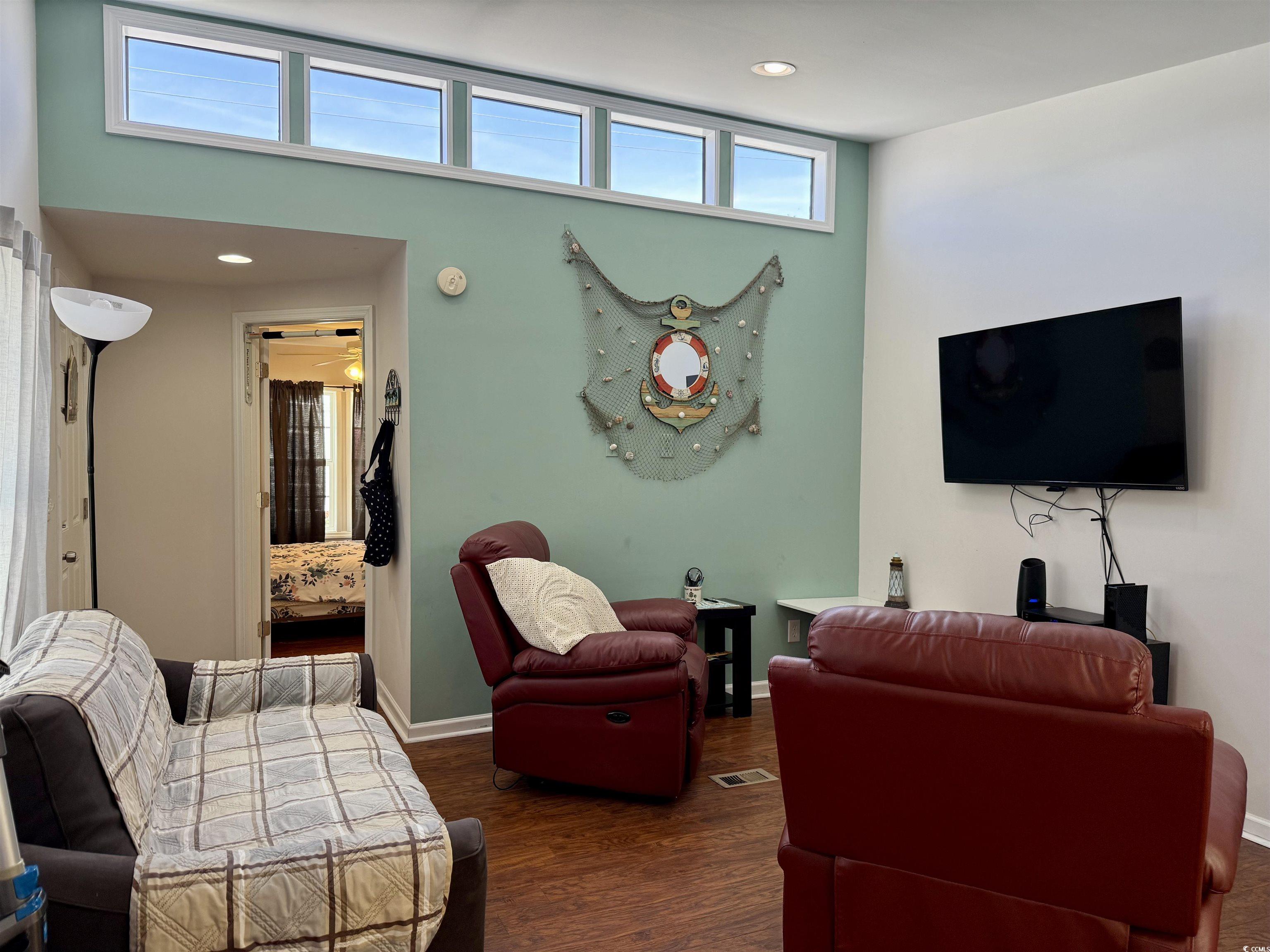 1760 Egret Surfside Beach, SC 29575 - Photo 8 of 29 Living area with dark wood finished floors and recessed lighting