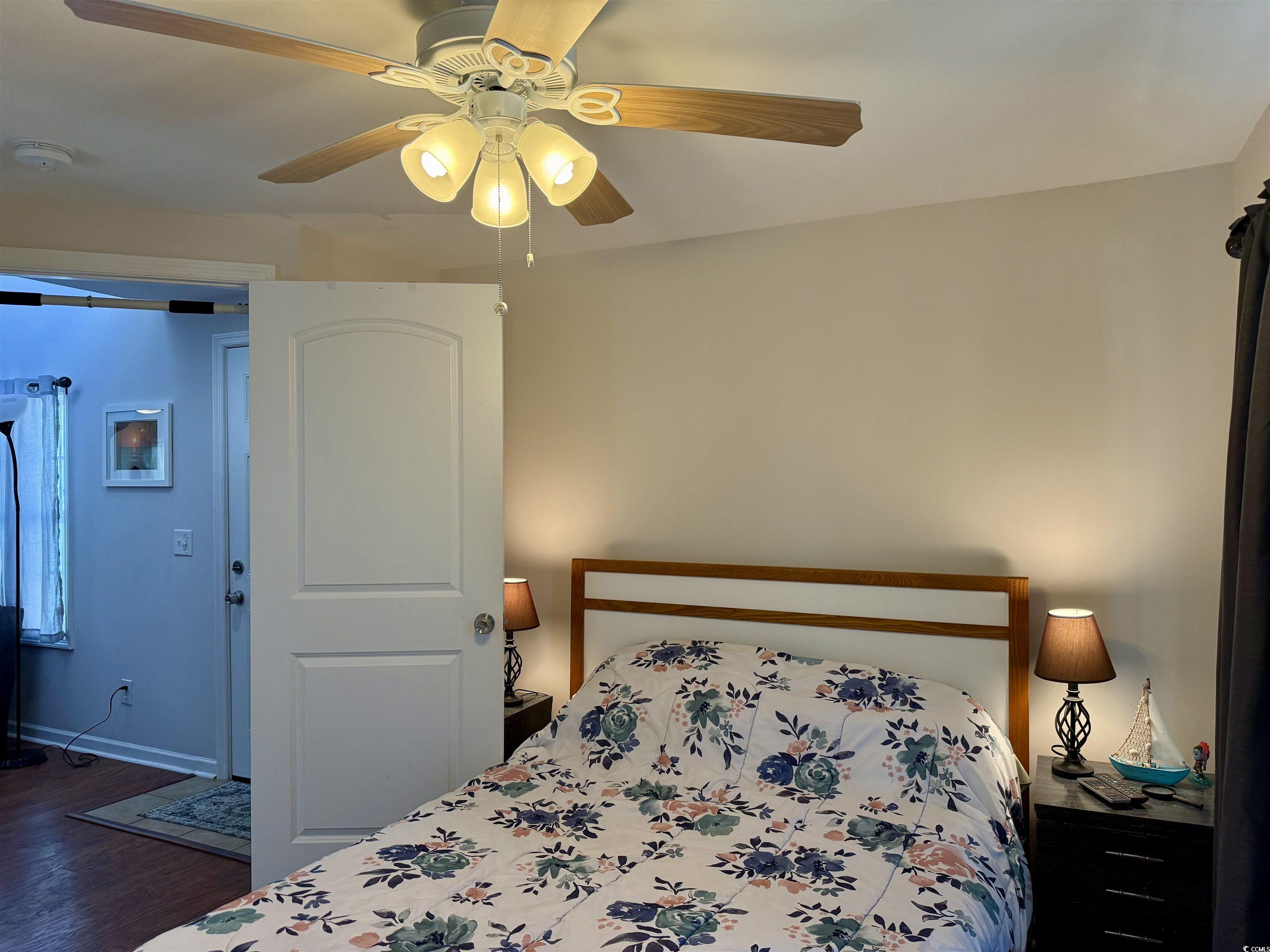 1760 Egret Surfside Beach, SC 29575 - Photo 9 of 29 Bedroom featuring wood finished floors and a ceiling fan