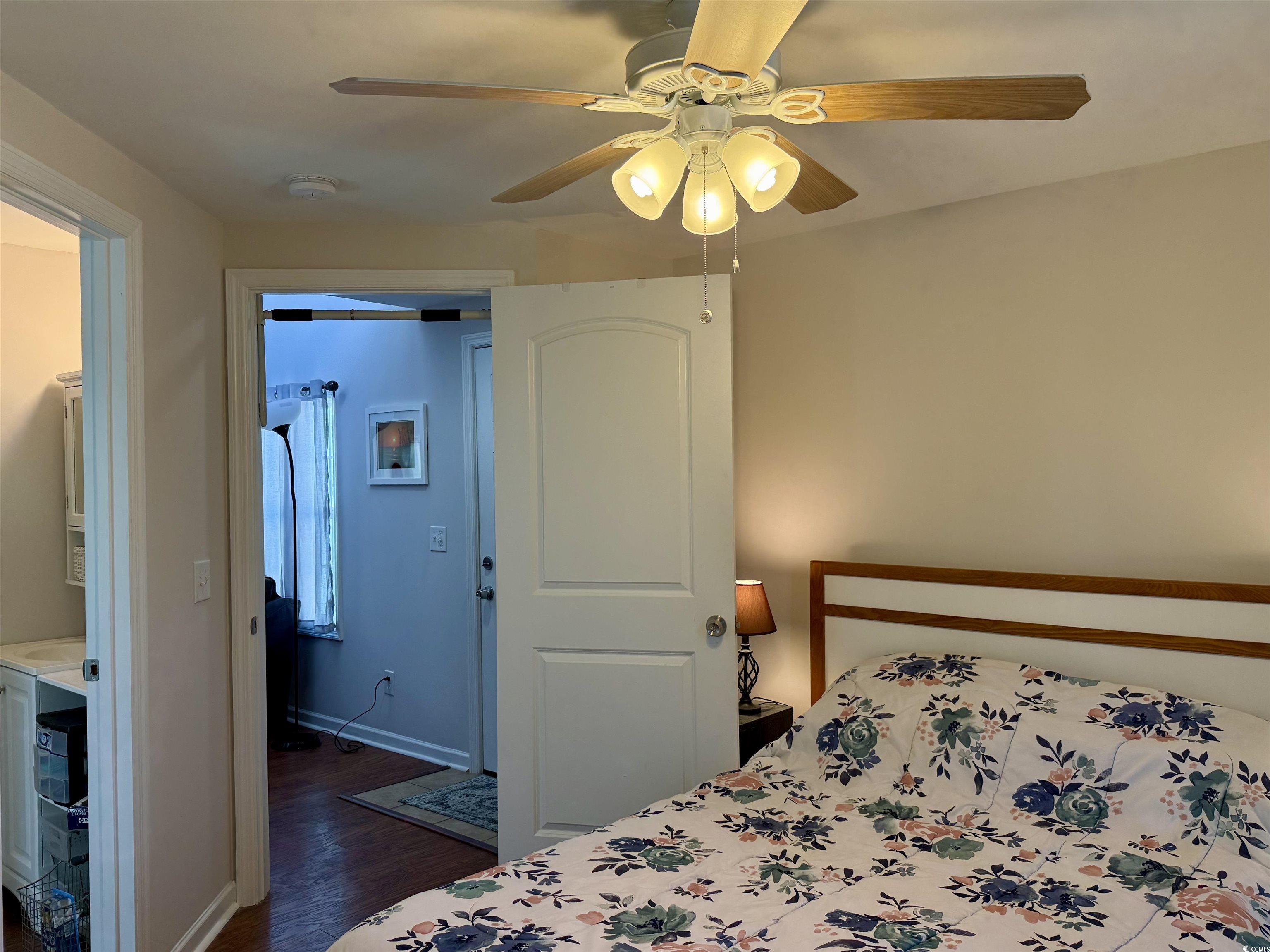 1760 Egret Surfside Beach, SC 29575 - Photo 10 of 29 Bedroom with dark wood-style flooring and ceiling fan
