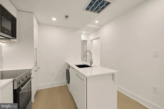 a kitchen with a stove and a microwave