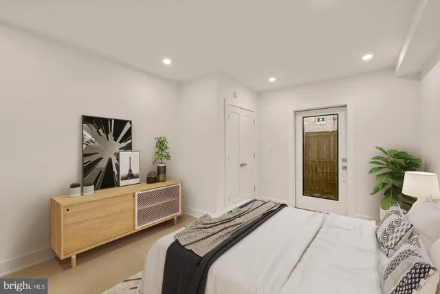 a bedroom with a bed and dresser