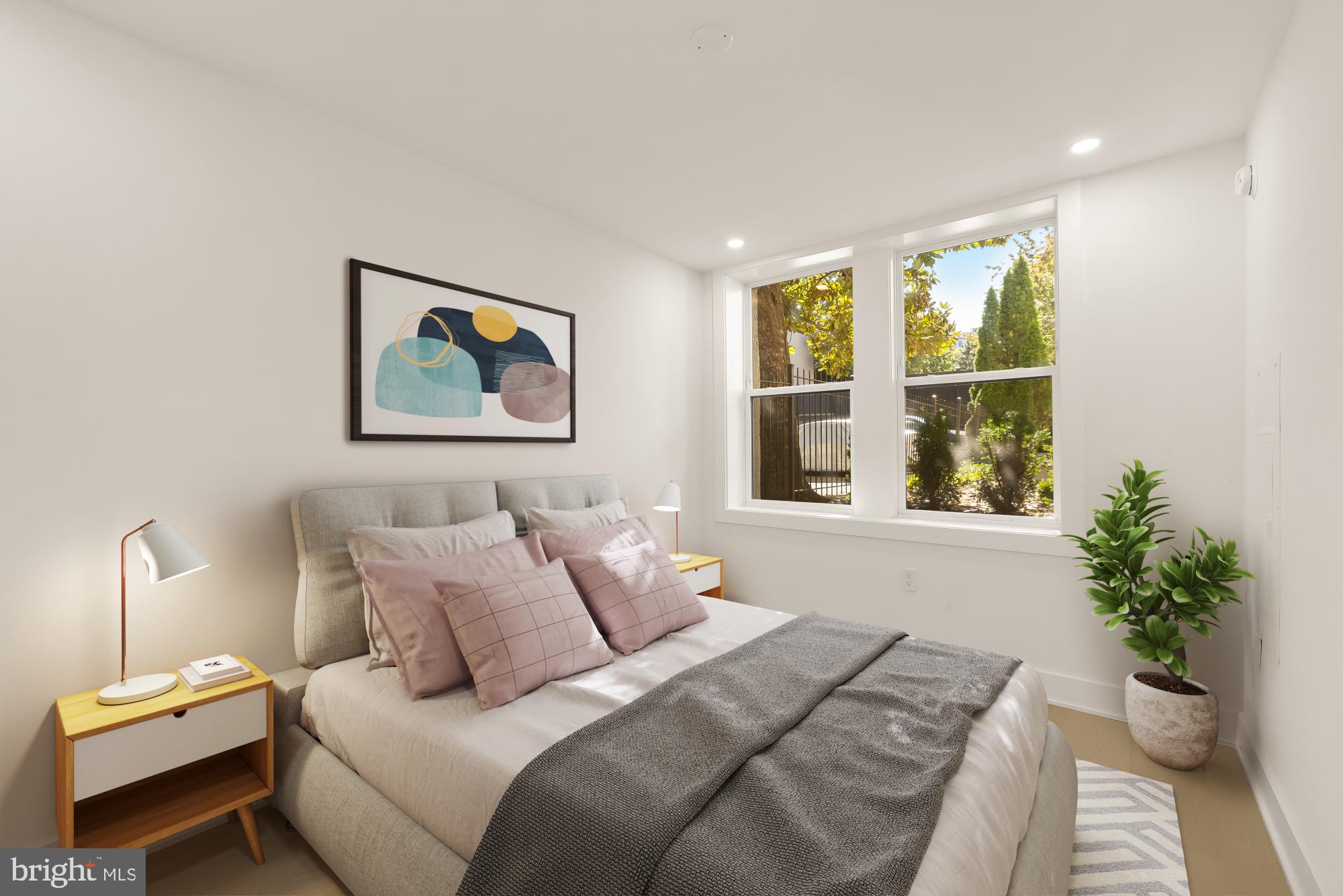 2116 Kalorama Road Northwest, Unit 104 Washington, DC 20008 - Photo 5 of 33 a bedroom with a bed and a large window