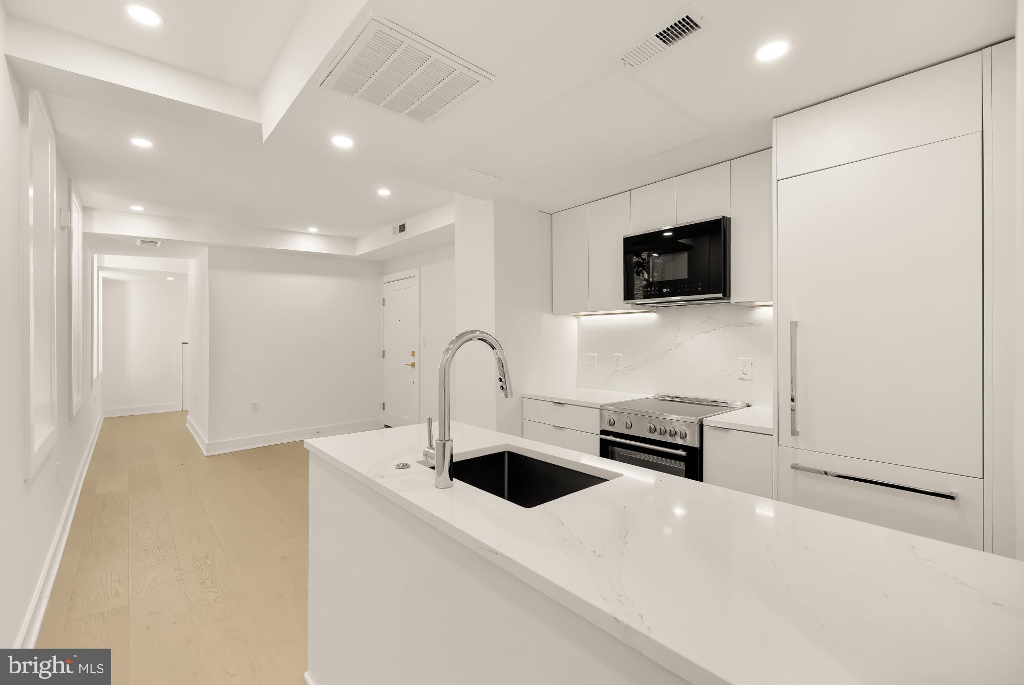 2116 Kalorama Road Northwest, Unit 104 Washington, DC 20008 - Photo 10 of 33 a kitchen with a sink a stove and oven