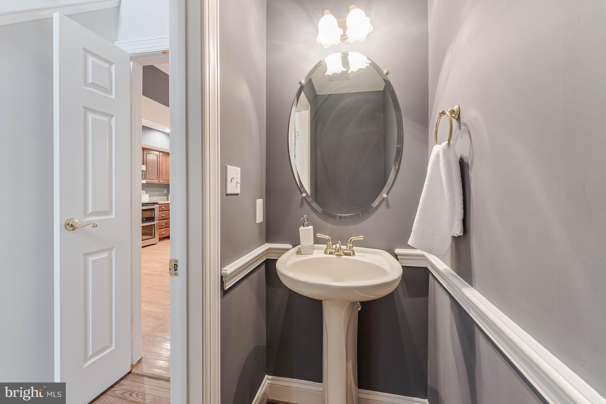 8926 Jameson Street Lorton, VA 22079 - Photo 14 of 32 a bathroom with a sink and a mirror