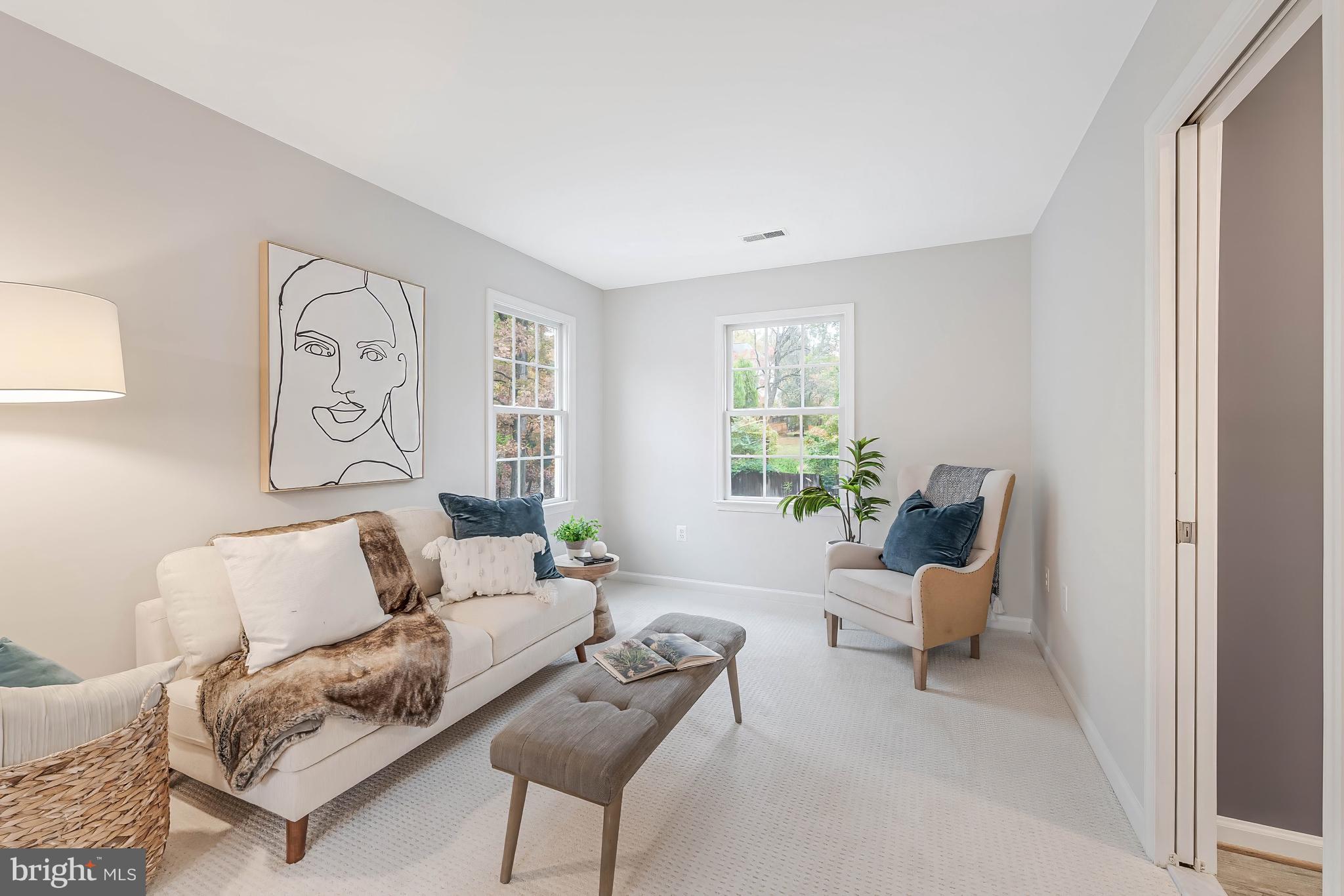8926 Jameson Street Lorton, VA 22079 - Photo 18 of 32 a living room with furniture and a window