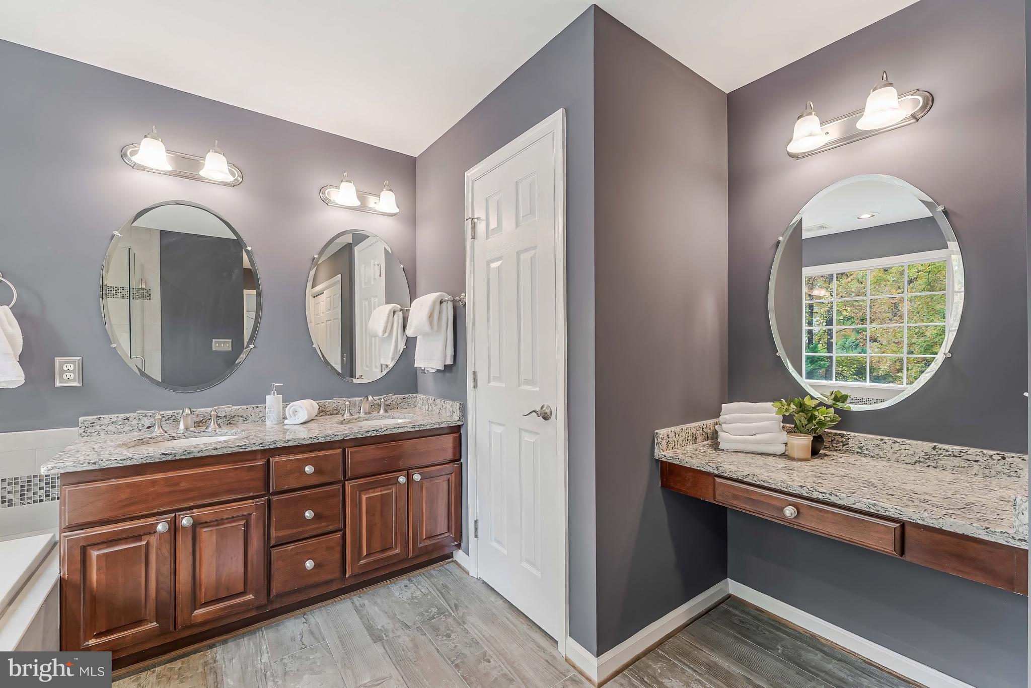 8926 Jameson Street Lorton, VA 22079 - Photo 20 of 32 a bathroom with a granite countertop double vanity sink and a mirror