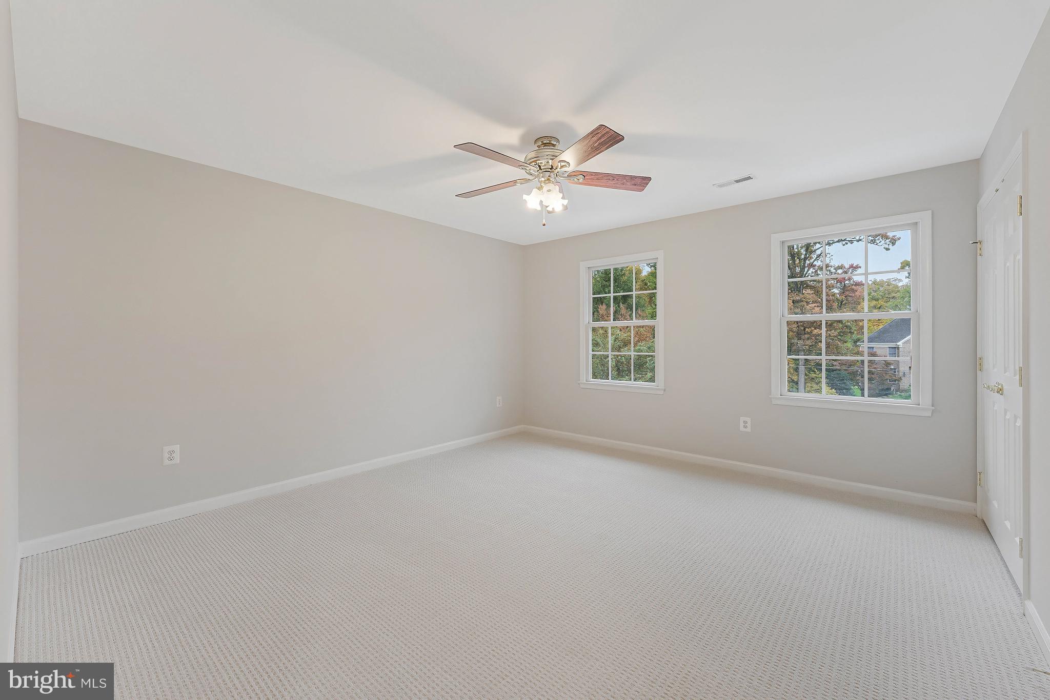 8926 Jameson Street Lorton, VA 22079 - Photo 23 of 32 an empty room with a window and a fan