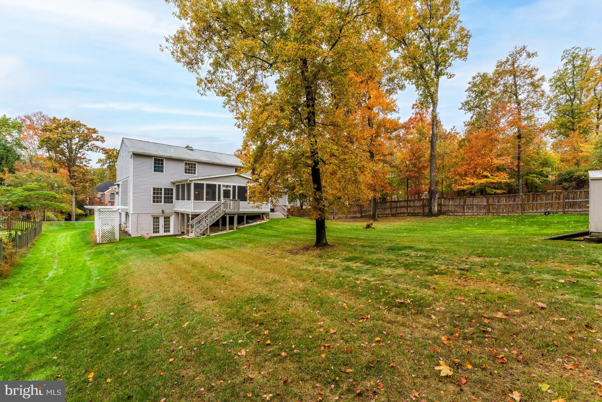8926 Jameson Street Lorton, VA 22079 - Photo 31 of 32 a view of a house with a big yard