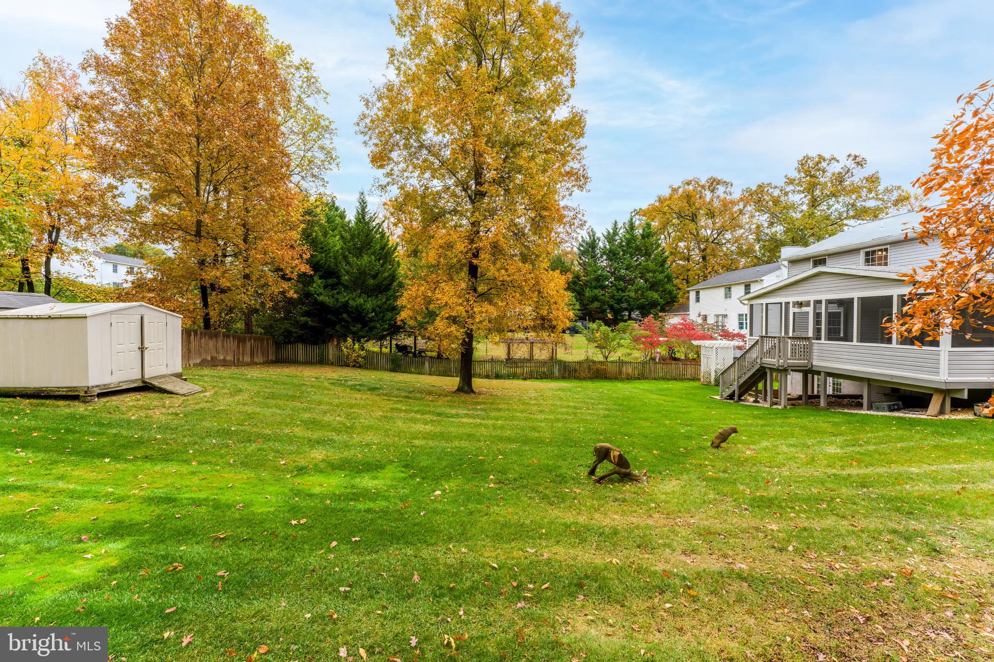 8926 Jameson Street Lorton, VA 22079 - Photo 32 of 32 a view of a house with a backyard