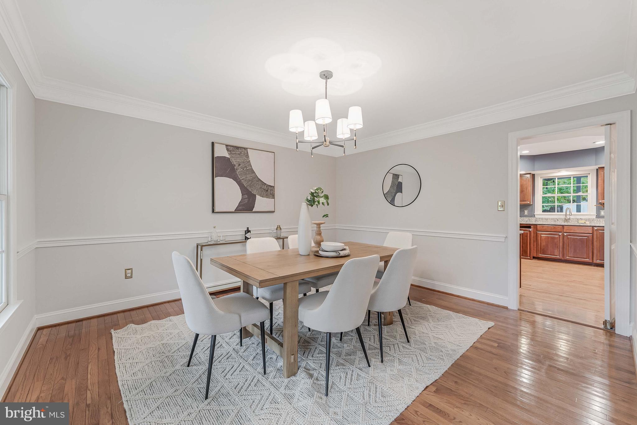 8926 Jameson Street Lorton, VA 22079 - Photo 4 of 32 a view of a dining room with furniture and wooden floor