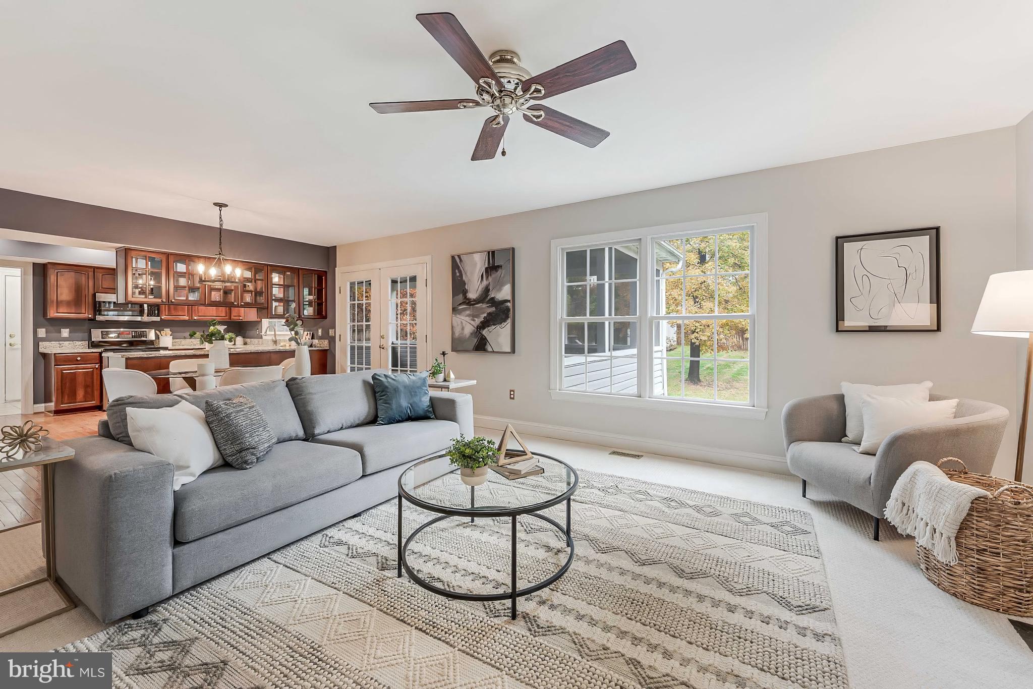 8926 Jameson Street Lorton, VA 22079 - Photo 6 of 32 a living room with furniture and a large window