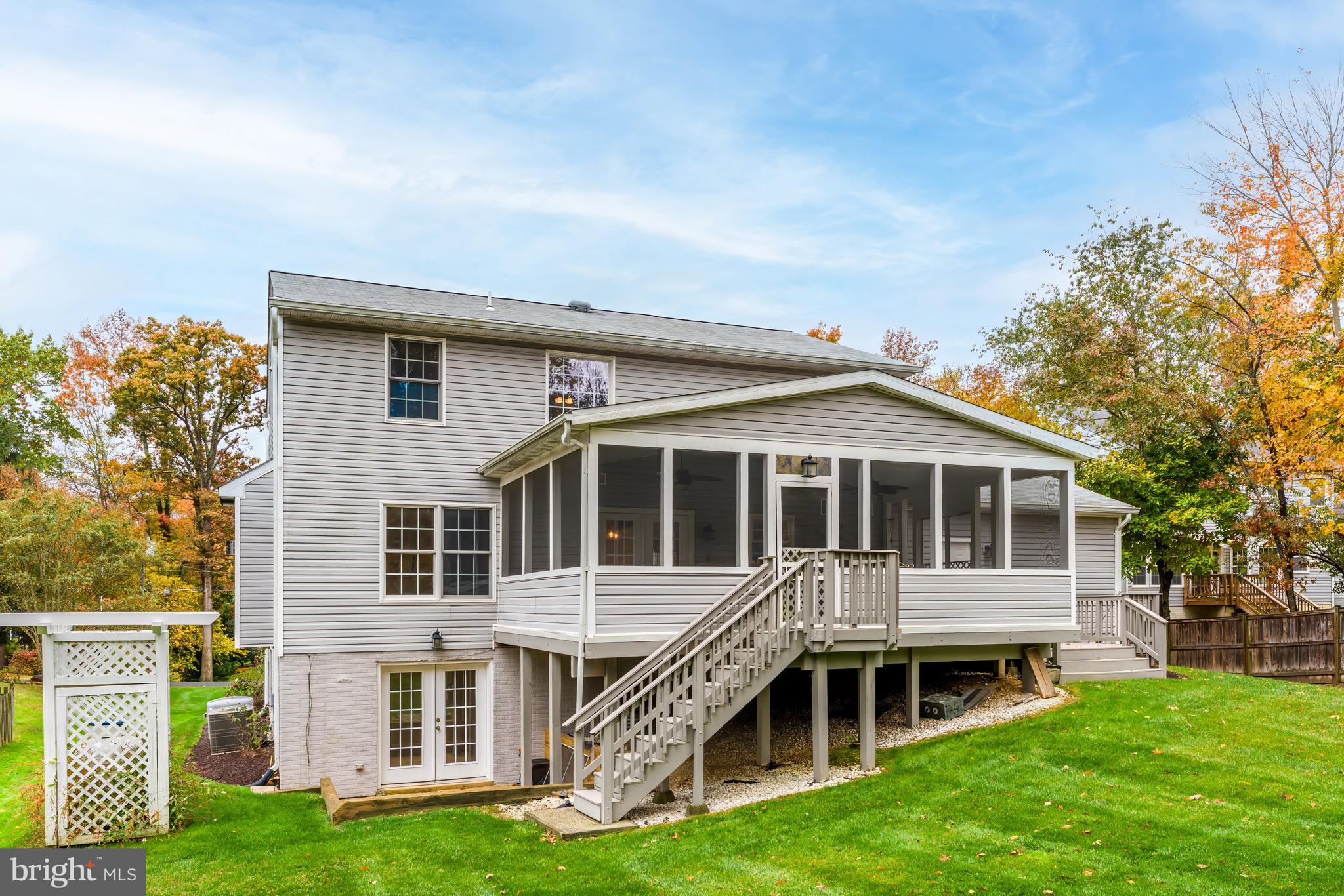 8926 Jameson Street Lorton, VA 22079 - Photo 9 of 32 a view of a house with a yard and sitting area