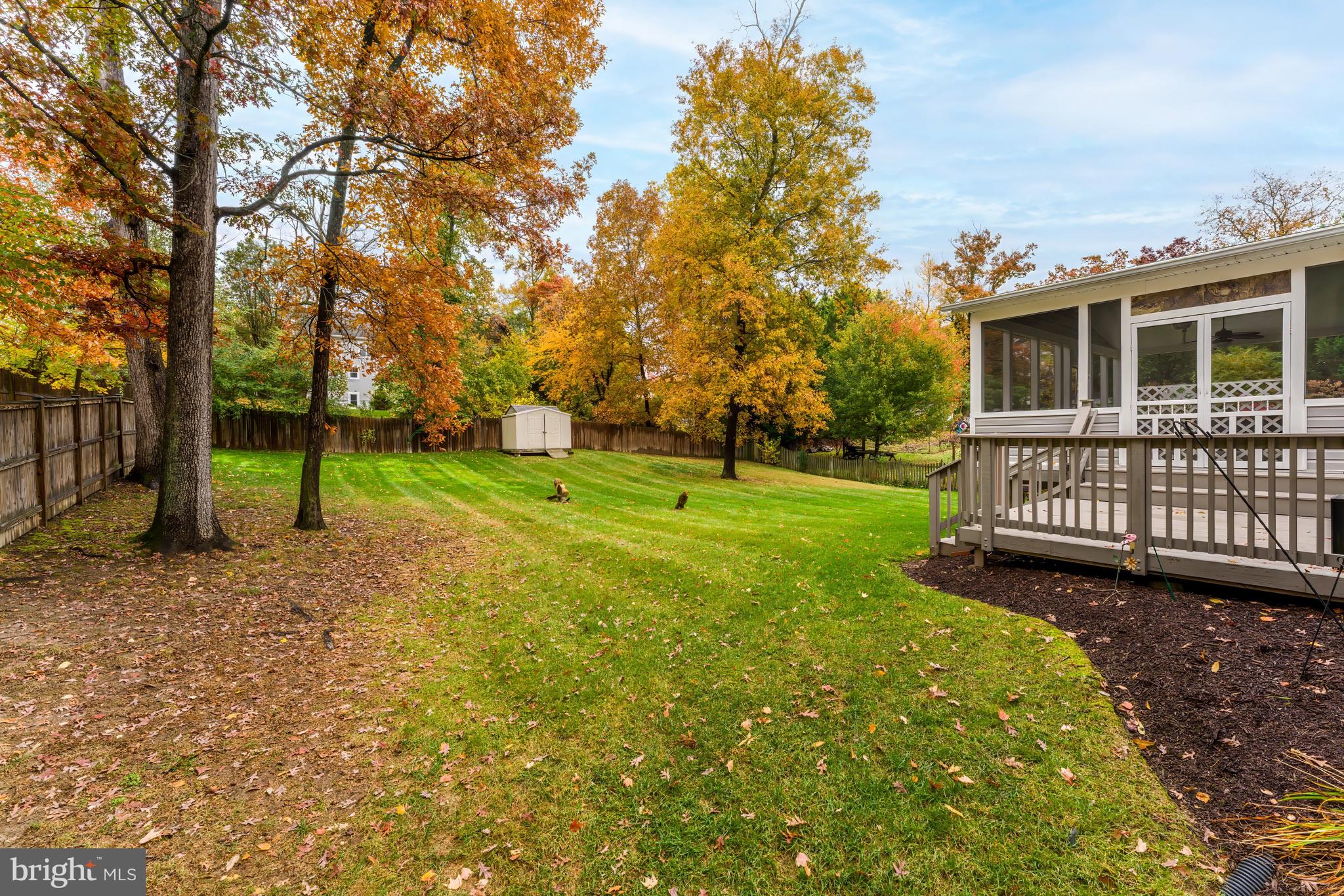 8926 Jameson Street Lorton, VA 22079 - Photo 10 of 32 a view of a house with backyard and trees