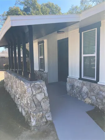 a bedroom with bed and window