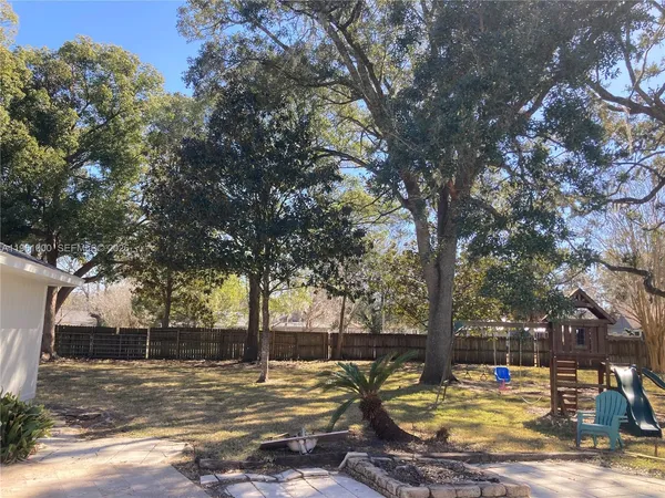 a view of a yard with trees