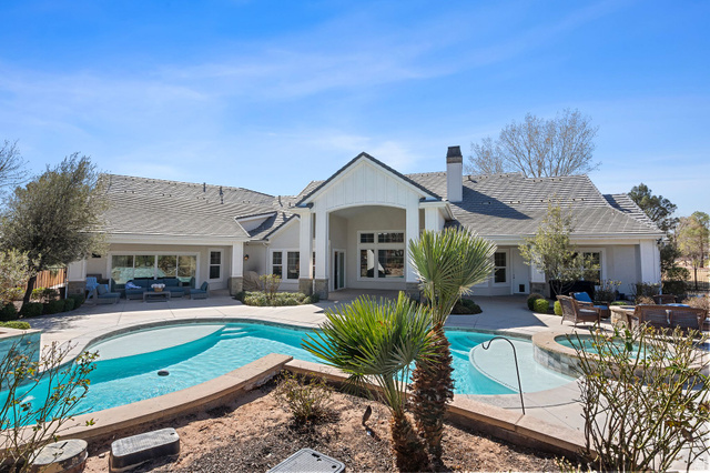 2917 Old Farm Road Washington, UT 84780 - Photo 46 of 105 Back of house featuring outdoor seating, a patio, a chimney, a pool with connected hot tub, and stucco siding