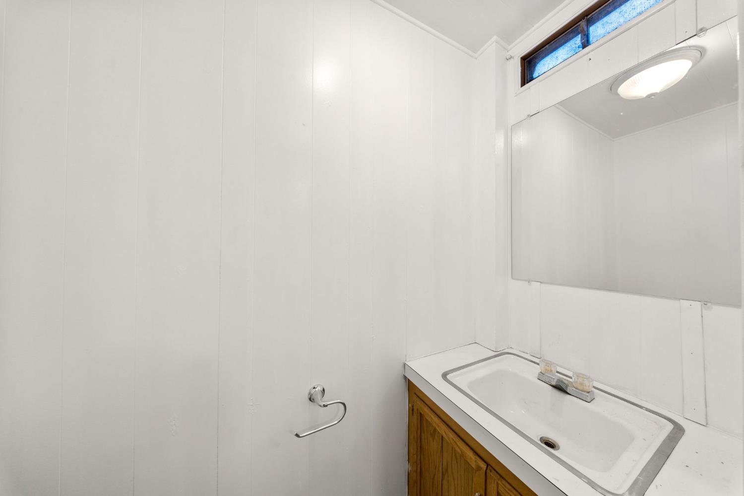 4482 Moran Road, Unit 12 Avery, CA 95224 - Photo 16 of 21 a bathroom with a sink and dryer