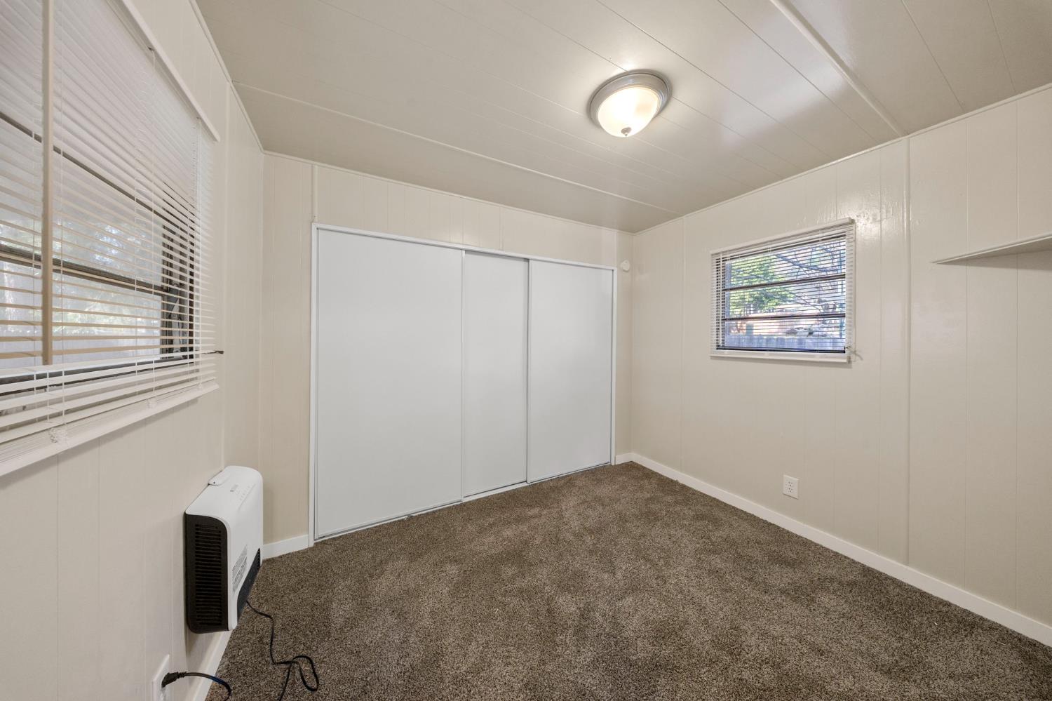 4482 Moran Road, Unit 12 Avery, CA 95224 - Photo 19 of 21 a view of a bedroom with a bed and a window
