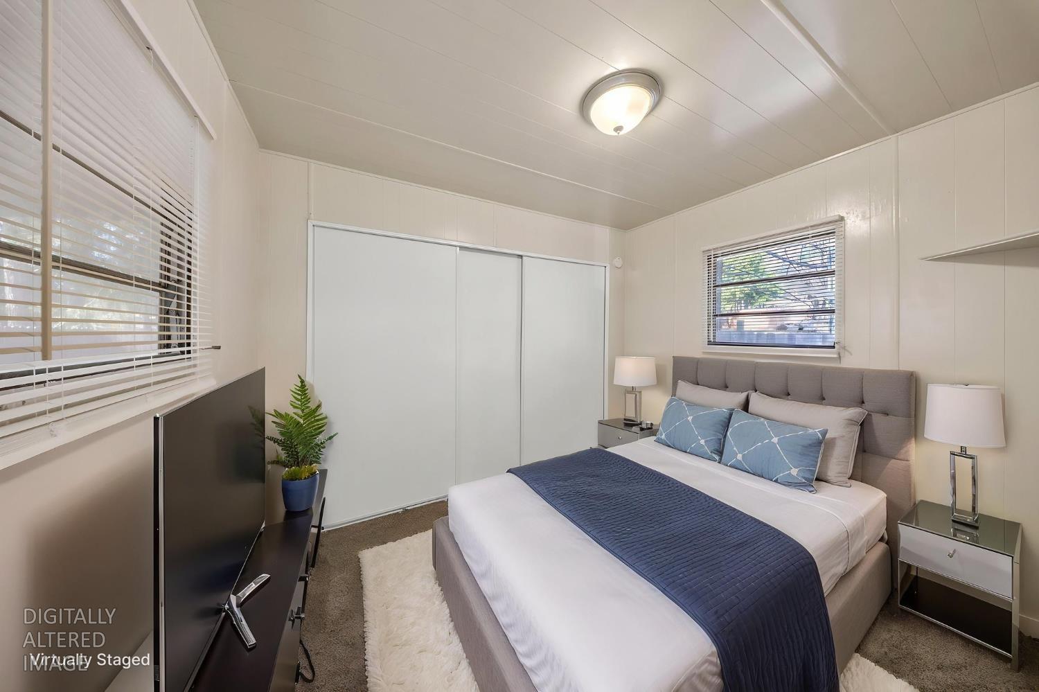 4482 Moran Road, Unit 12 Avery, CA 95224 - Photo 20 of 21 a bedroom with a large bed and a potted plant