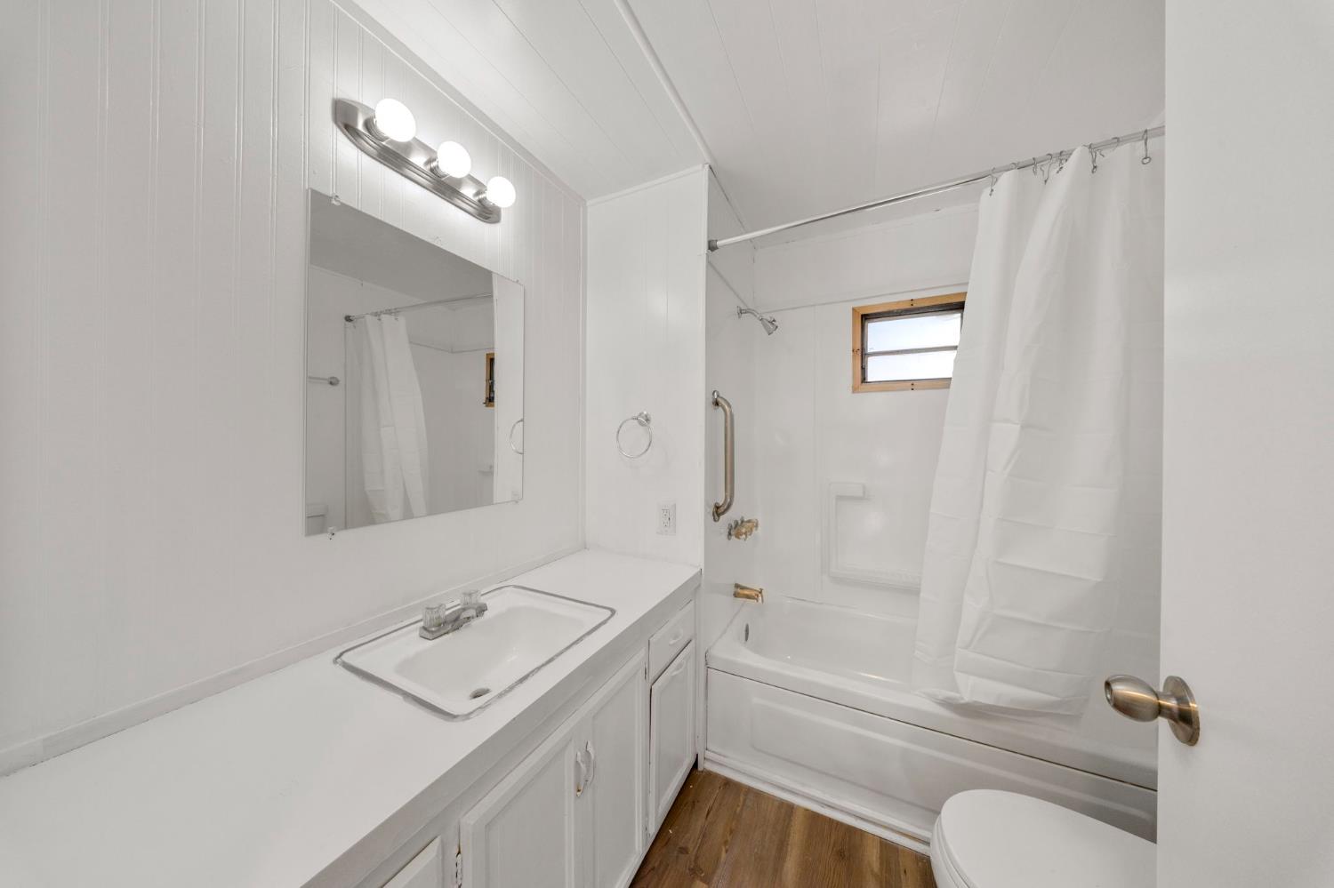 4482 Moran Road, Unit 12 Avery, CA 95224 - Photo 21 of 21 a bathroom with a sink a toilet and shower