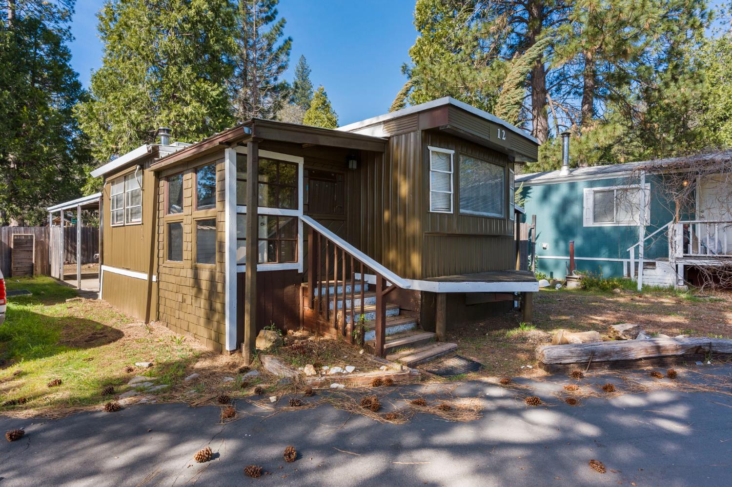 4482 Moran Road, Unit 12 Avery, CA 95224 - Photo 3 of 21 a front view of a house with a yard balcony