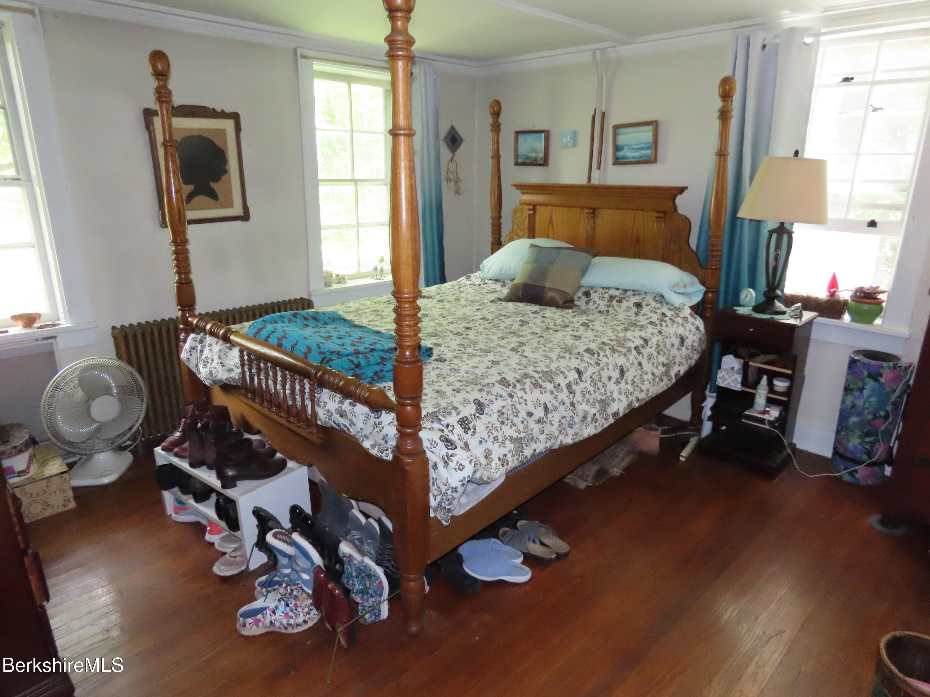 1138 Main Road Stamford, VT 05352 - Photo 15 of 46 a bedroom with a bed and wooden floor