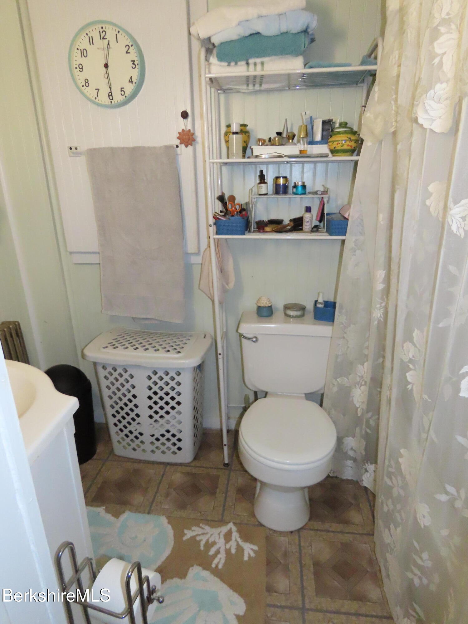 1138 Main Road Stamford, VT 05352 - Photo 16 of 46 a bathroom with a toilet and a shower curtain