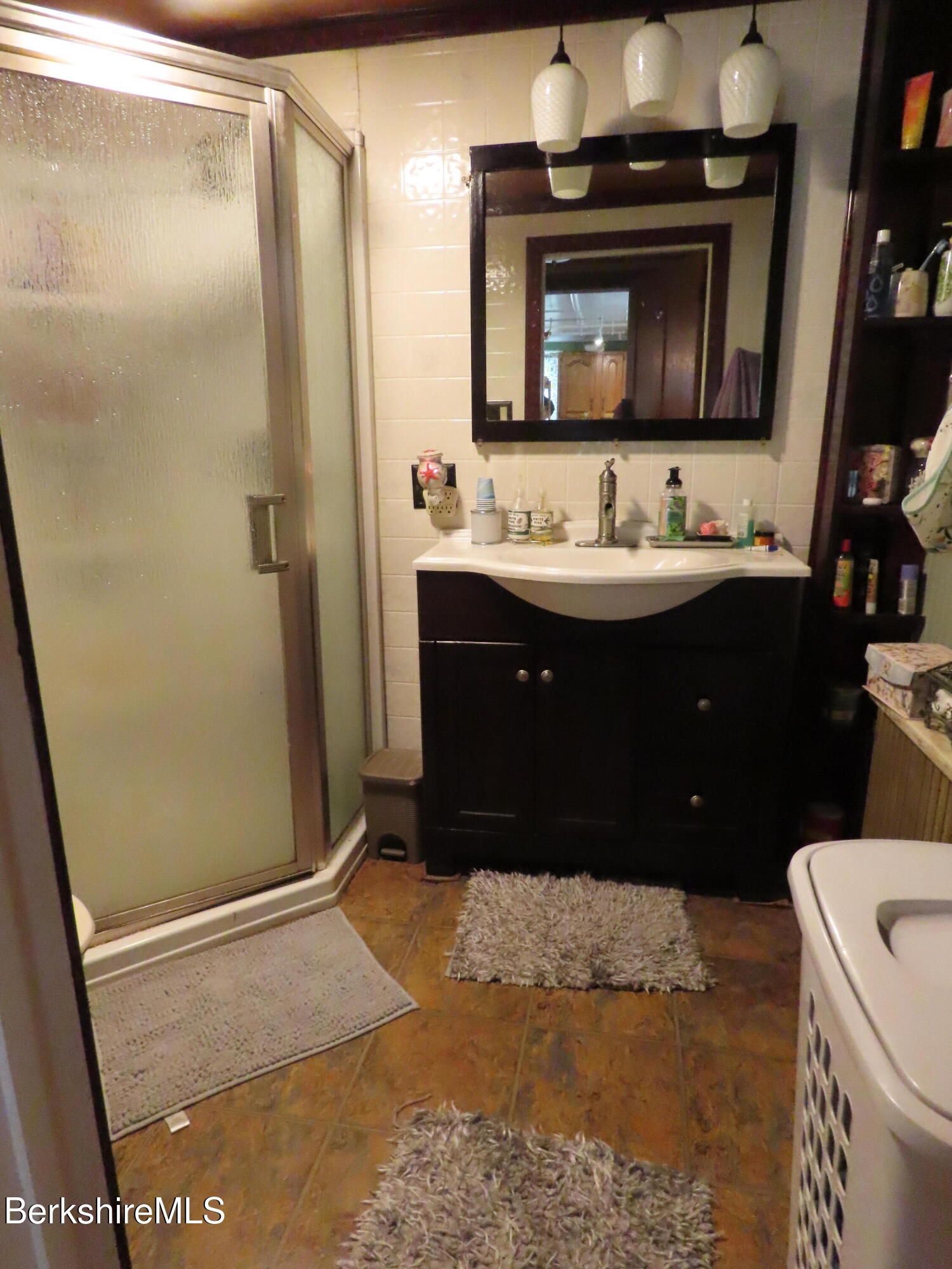 1138 Main Road Stamford, VT 05352 - Photo 23 of 46 a bathroom with a sink vanity and a mirror