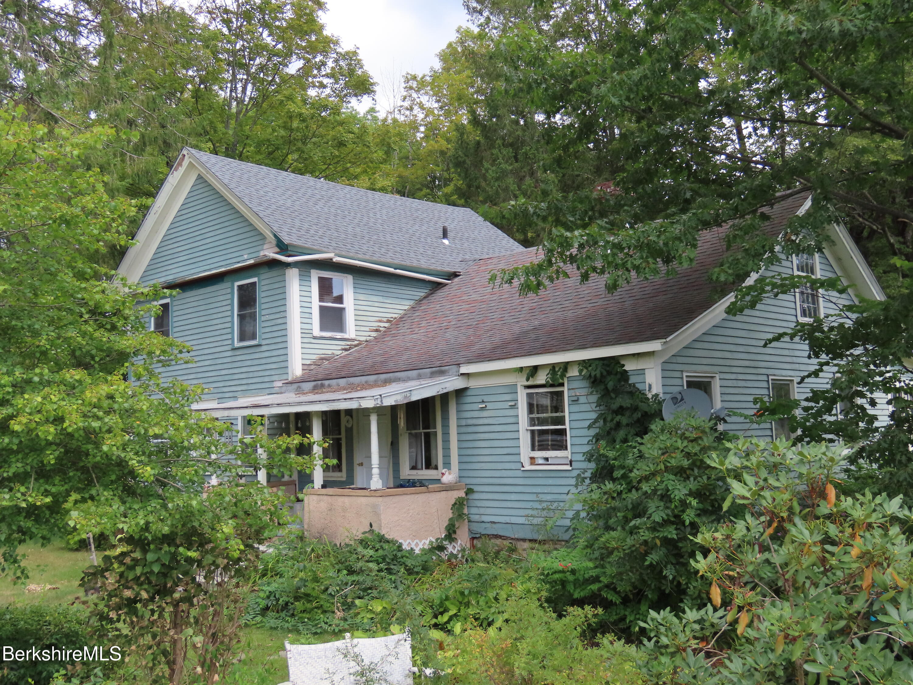 1138 Main Road Stamford, VT 05352 - Photo 24 of 46 a front view of house with a garden