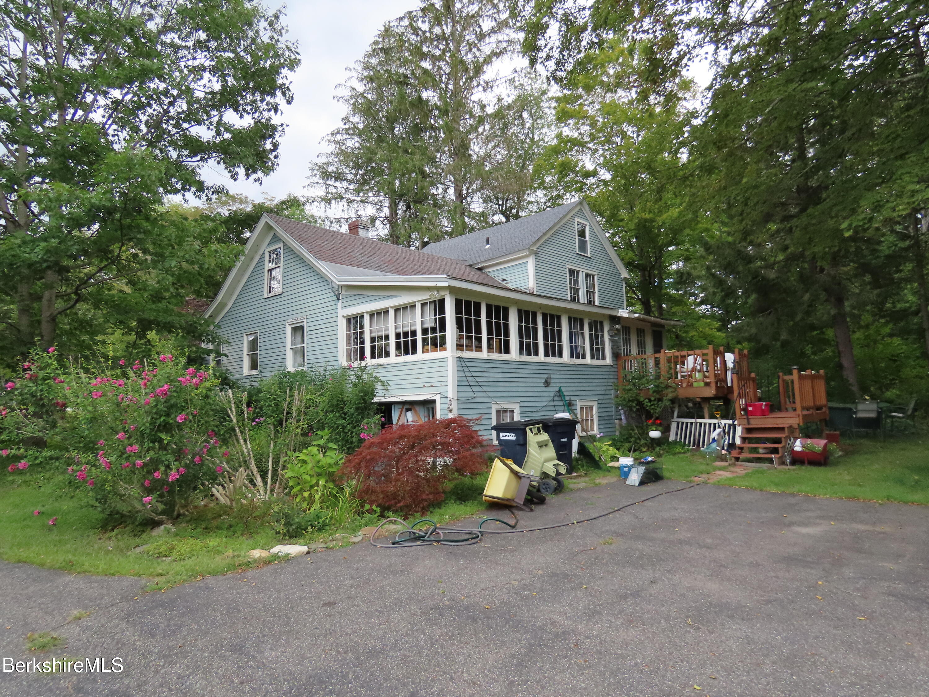 1138 Main Road Stamford, VT 05352 - Photo 26 of 46 a front view of a house with a garden and trees