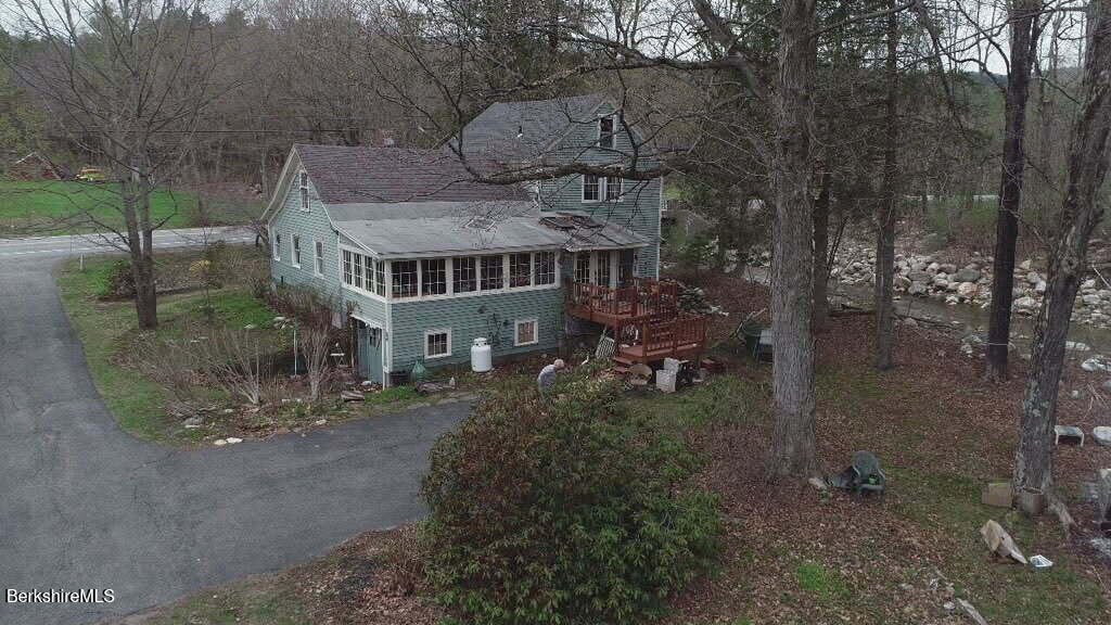 1138 Main Road Stamford, VT 05352 - Photo 3 of 46 a aerial view of a house with a yard