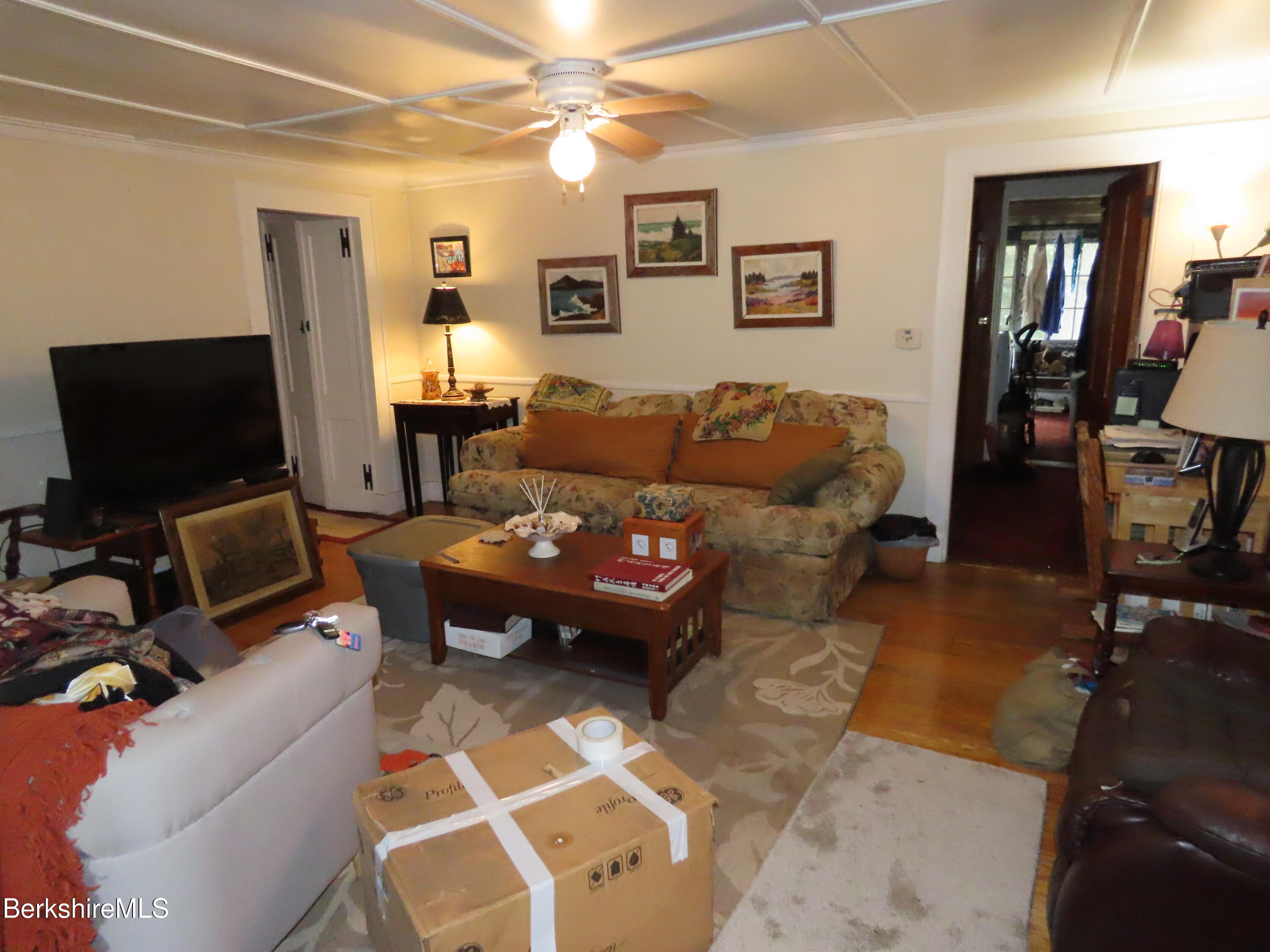 1138 Main Road Stamford, VT 05352 - Photo 9 of 46 a living room with furniture and a flat screen tv