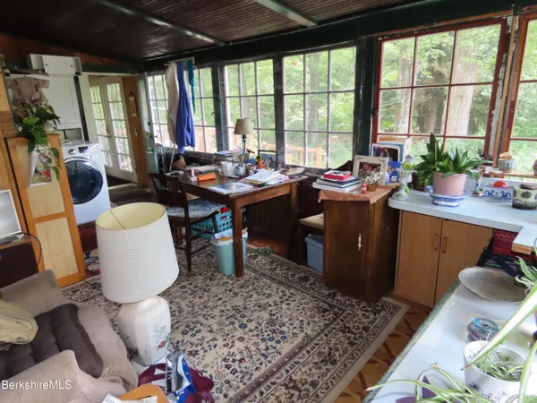 a view of a dining room with furniture window and outside view